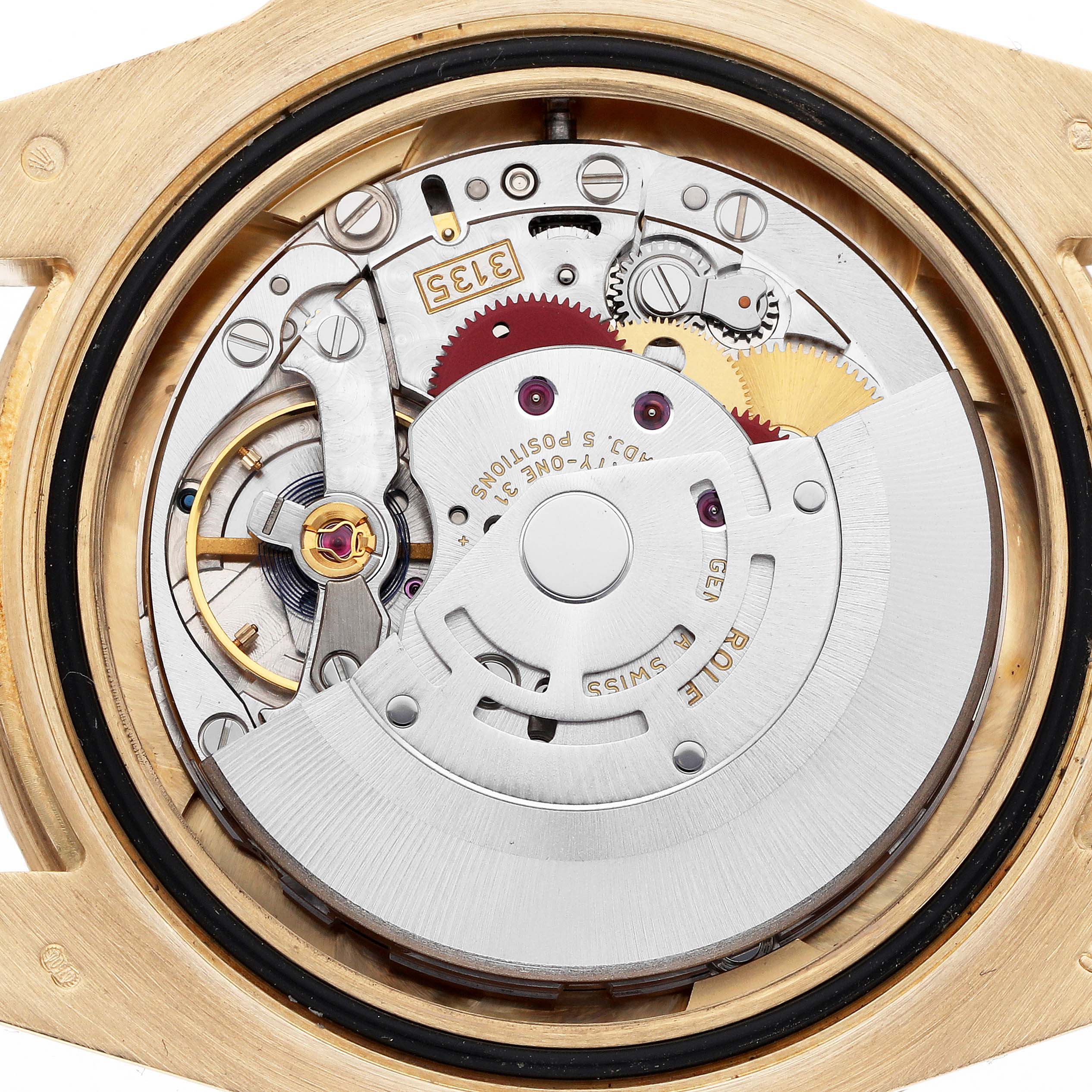 This image shows the internal movement of a Rolex Submariner 116618 Men
s Yellow Gold Black Dial, viewed from the back, revealing gears and mechanical components.