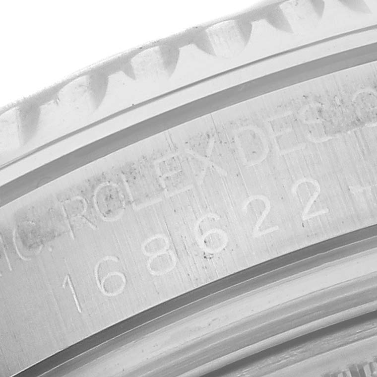 The image shows a close-up of the engraved case back edge of a Rolex Yacht-Master 168622 Men's Stainless Steel Silver Dial 168622 Men's Stainless Steel Silver Dial model.