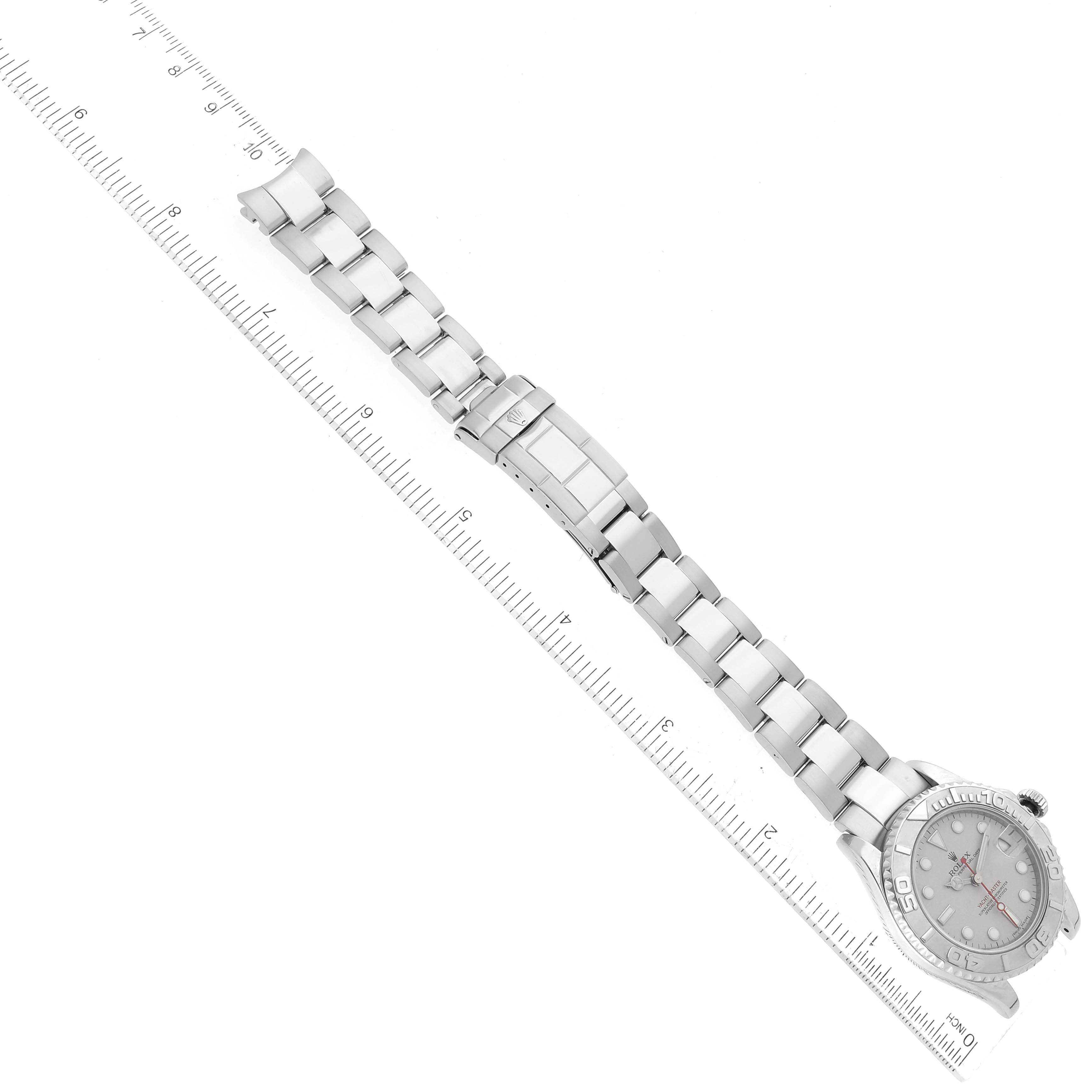 The image shows a Rolex Yacht-Master 168622 Men's Stainless Steel Silver Dial 168622 Men's Stainless Steel Silver Dial watch laid flat, featuring its full bracelet and clasp next to a ruler for measurement.