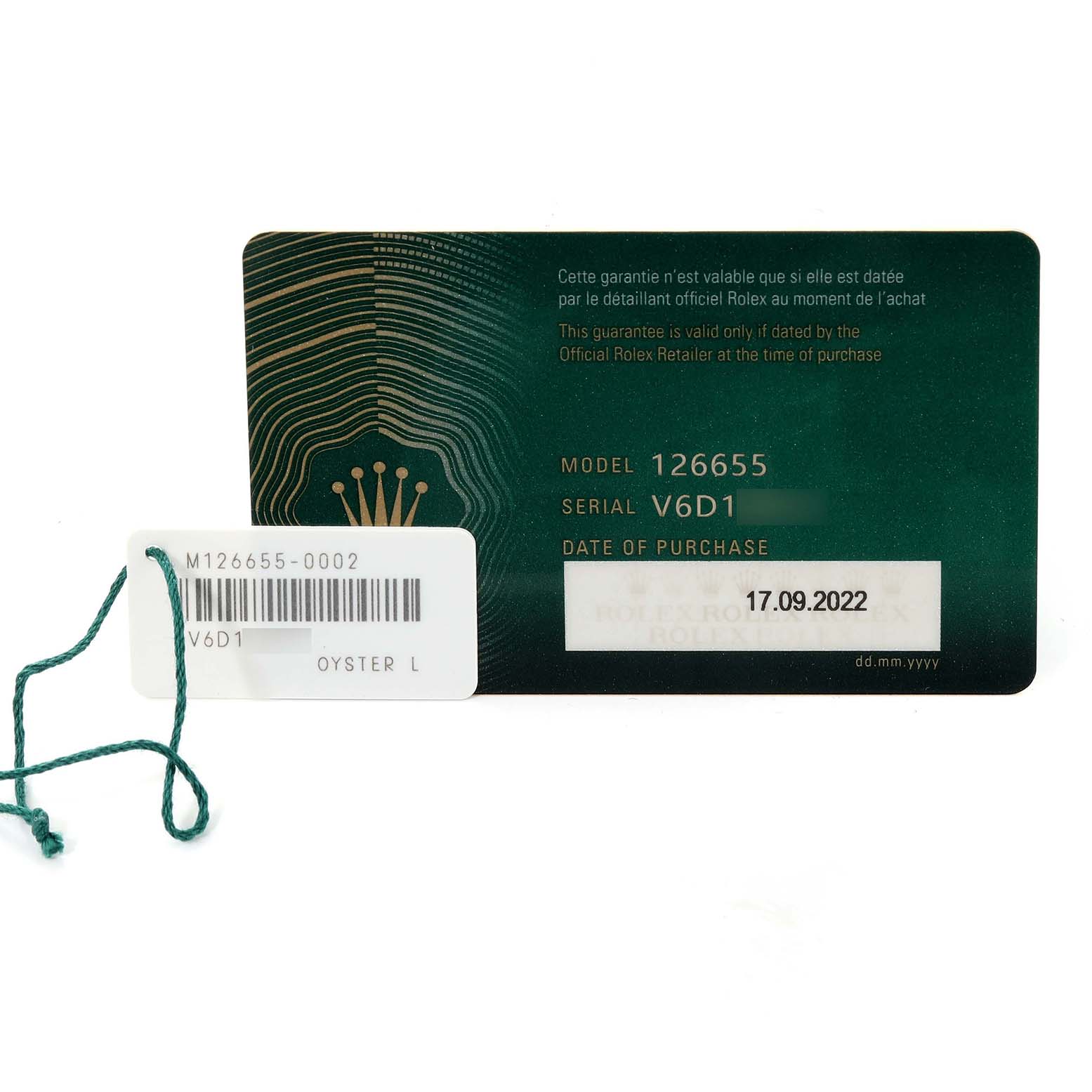 This image shows a warranty card and a tag for the Rolex Yacht-Master 126655 Men's Rose Gold Black Dial 126655 Men's Rose Gold Black Dial model 126655.