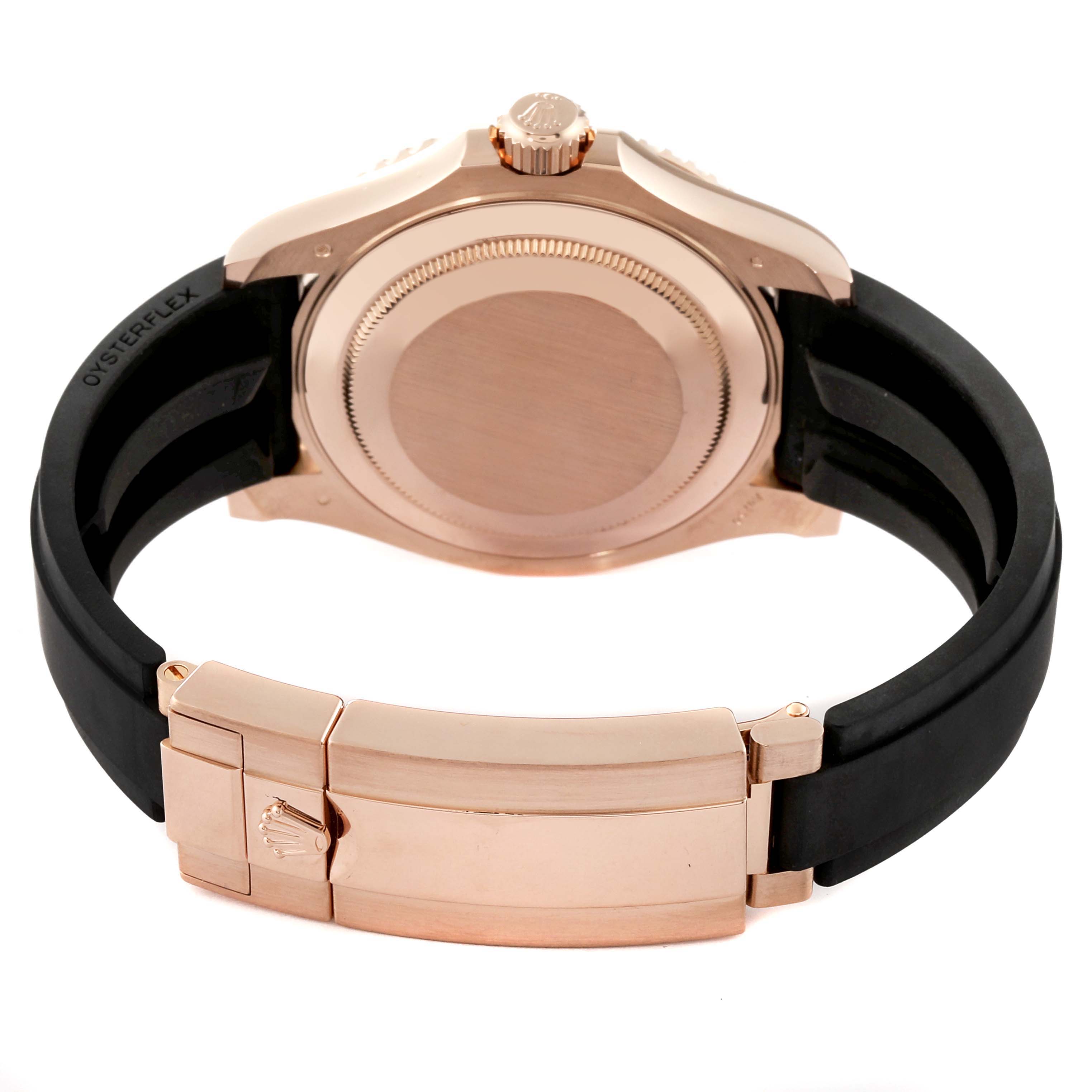 This image shows the back side and clasp of a Rolex Yacht-Master 126655 Men's Rose Gold Black Dial 126655 Men's Rose Gold Black Dial watch with a black strap and rose gold detailing.