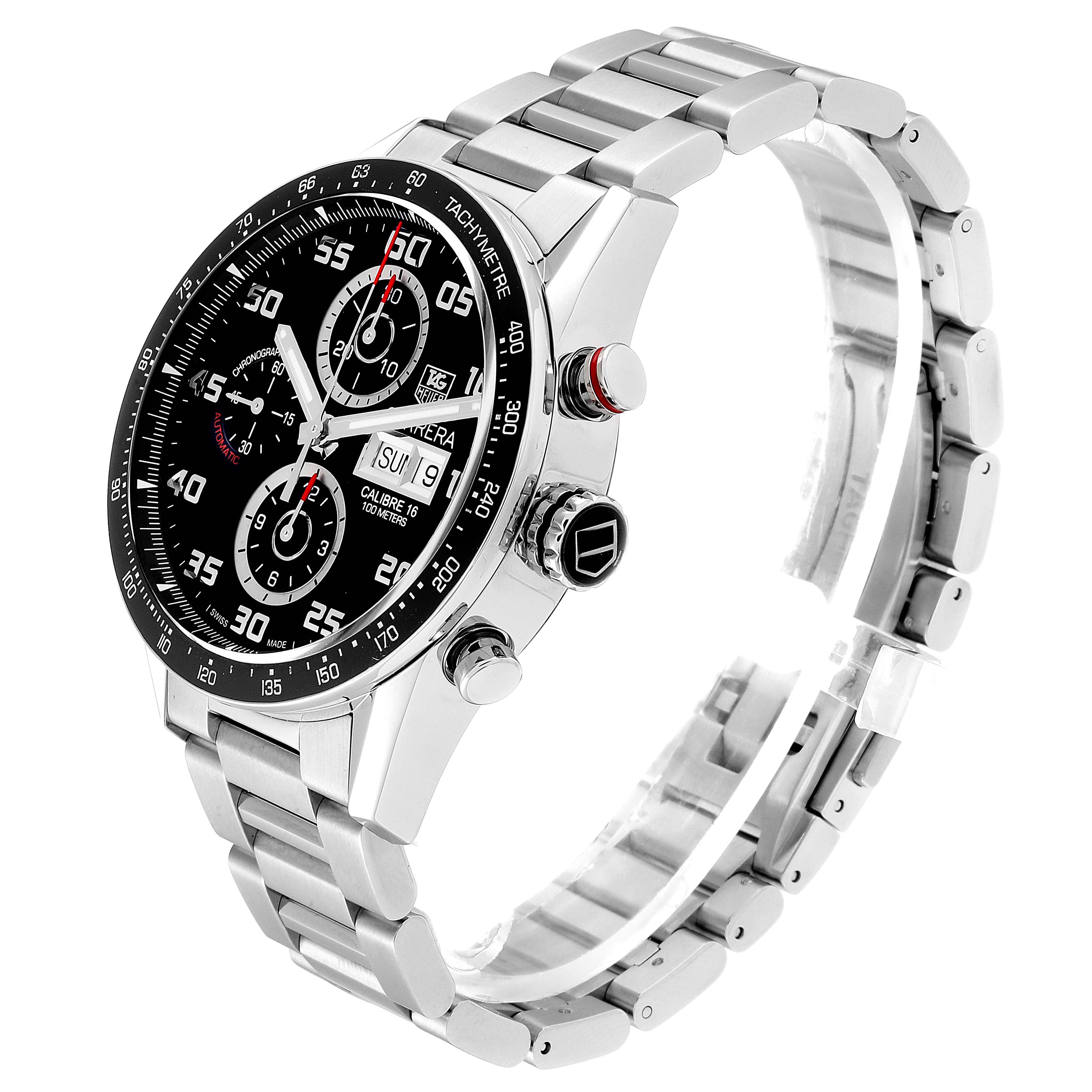 The Carrera model by Tag Heuer is shown at a slight angle, displaying the face, buttons, and metal bracelet.