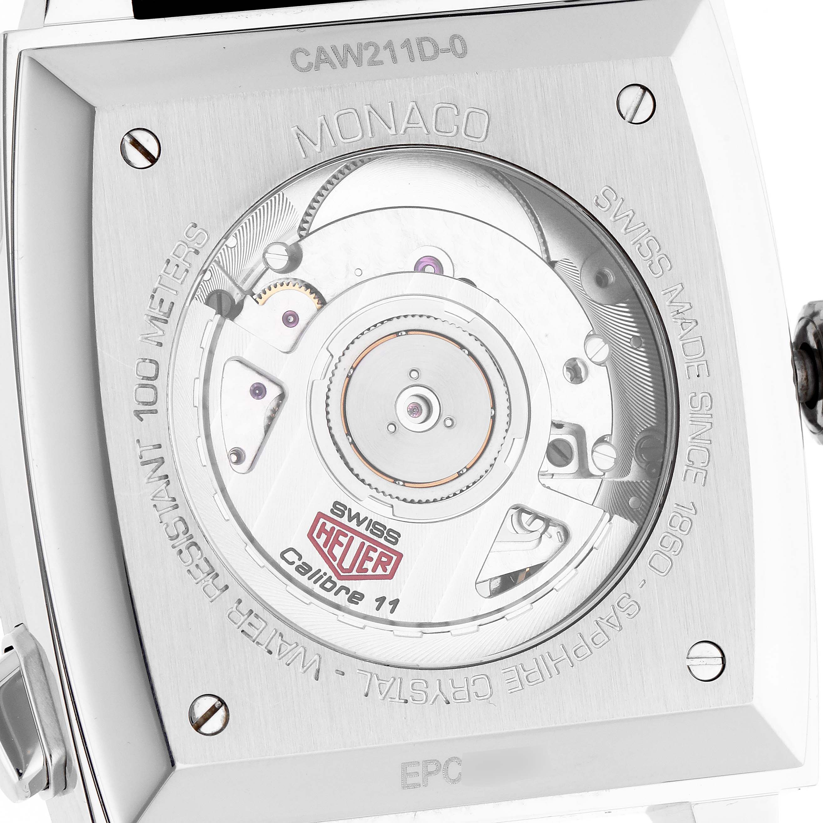The image shows the back of the TAG Heuer Monaco watch, highlighting its movement and engraving details.