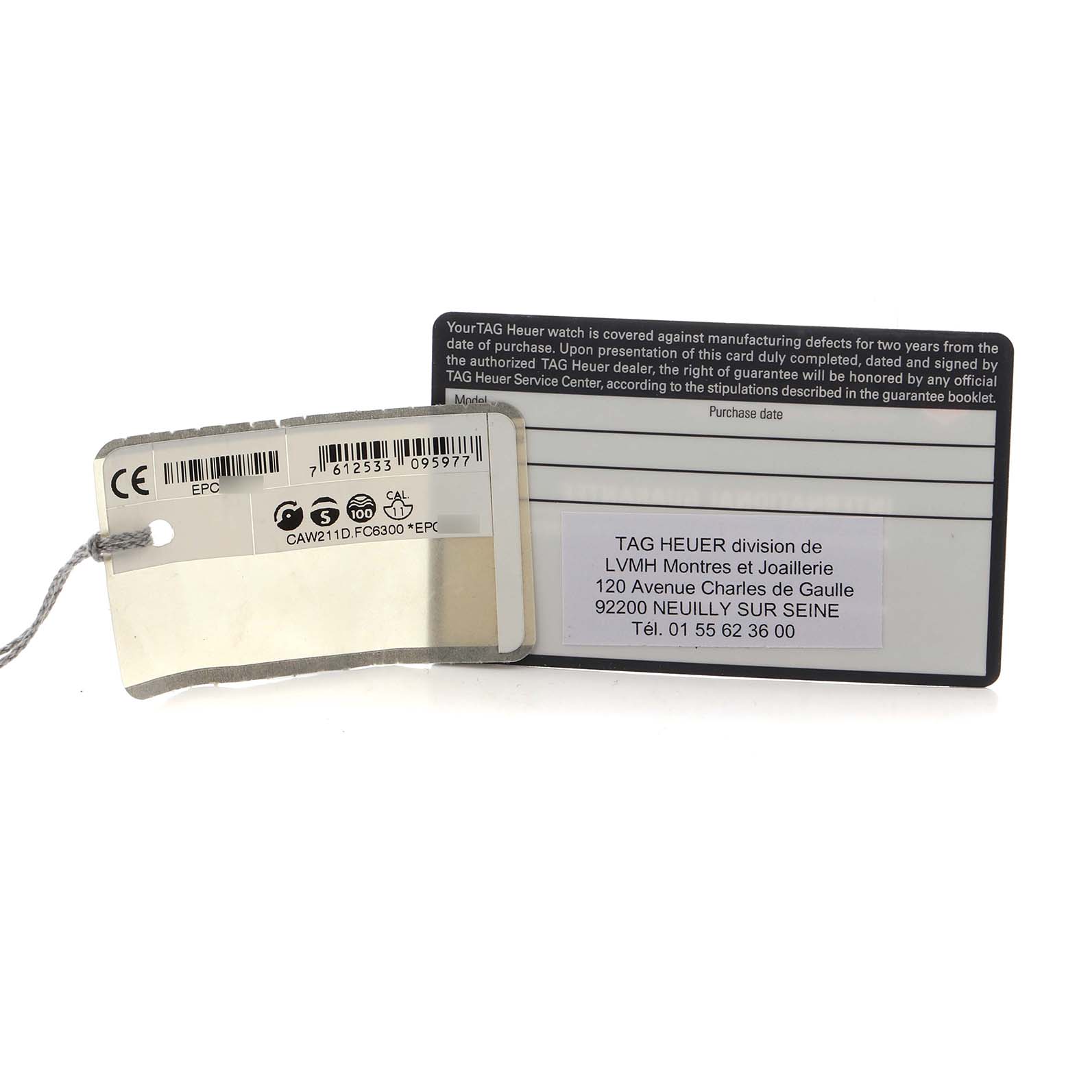 The image shows the backside of a warranty card and a tag for the TAG Heuer Monaco watch.