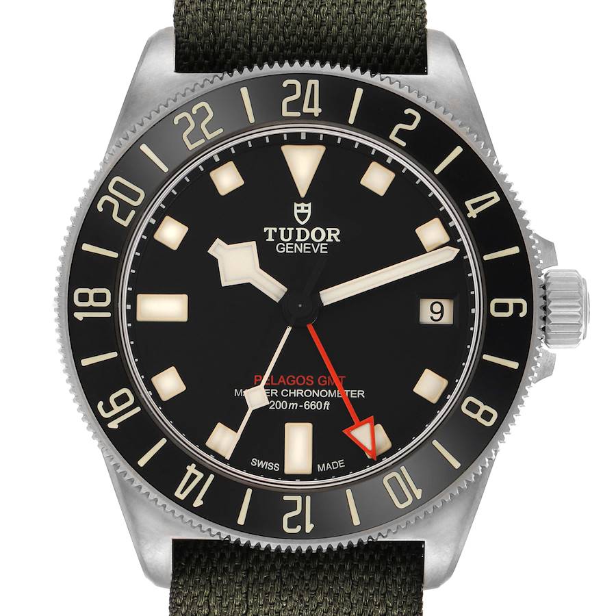 The Tudor Pelagos M2542G257NU Men's Titanium Black Dial watch is shown from a front angle, highlighting its dial, bezel, crown, and fabric strap.