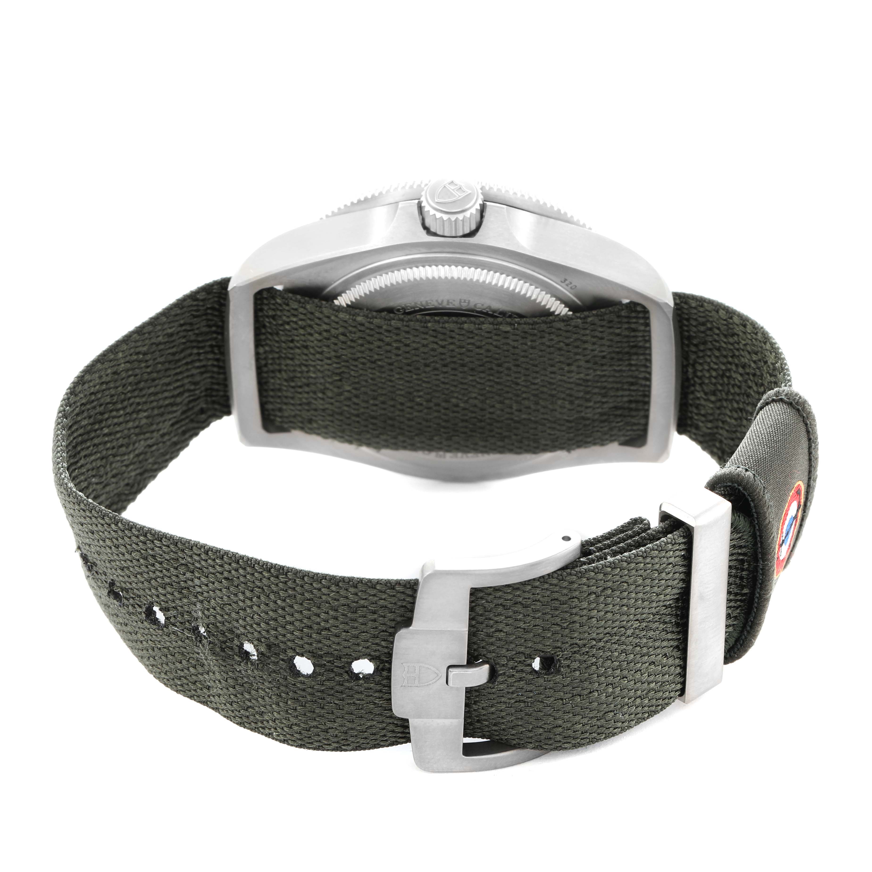 The image shows the side angle of a Tudor Pelagos M2542G257NU Men
s Titanium Black Dial watch, highlighting the crown and fabric strap.