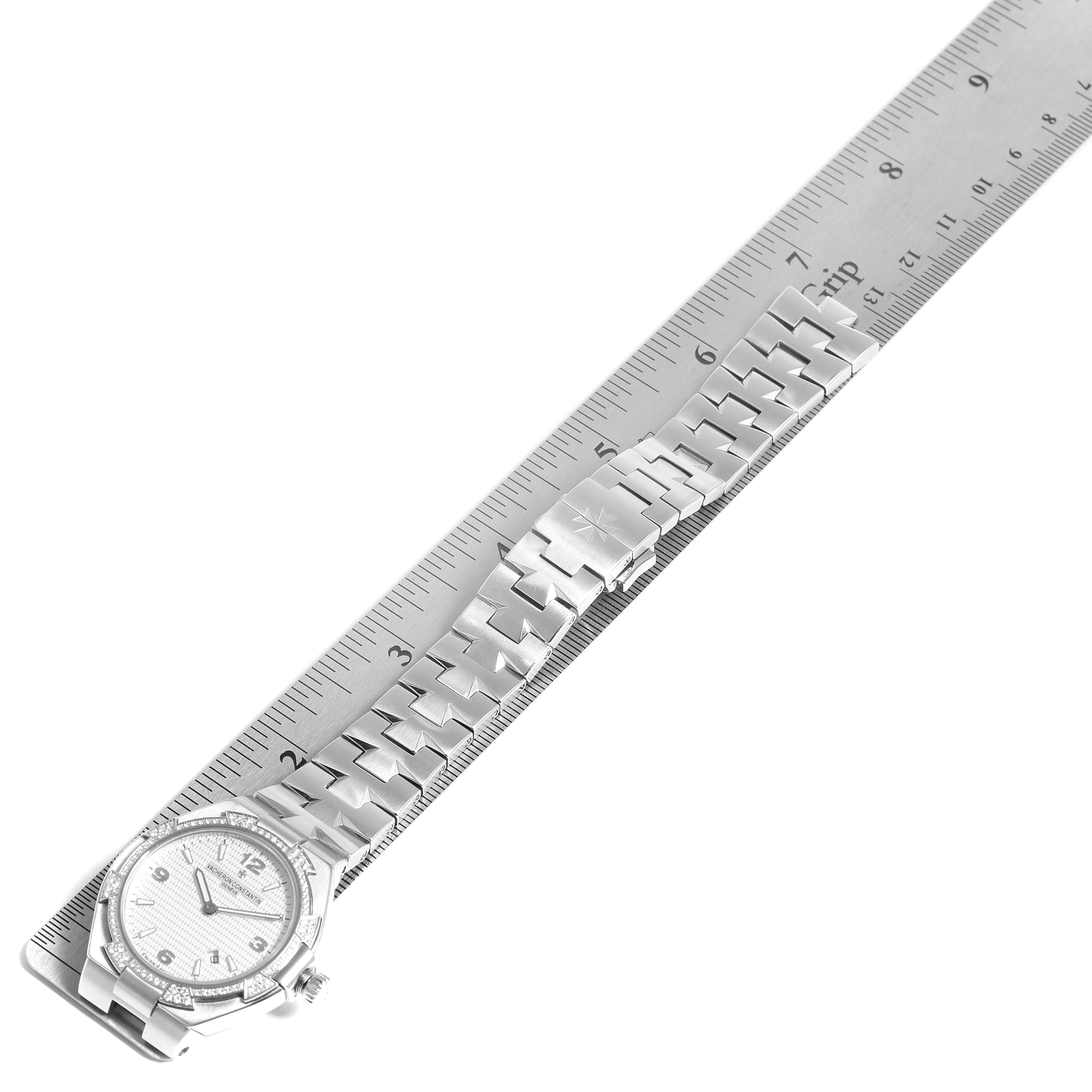 The Vacheron Constantin Overseas 25750/D01A/9123 Women's Stainless Steel Silver Dial 25750/D01A/9123 Women's Stainless Steel Silver Dial watch is shown from an overhead angle with its face and full metal bracelet displayed along a ruler.