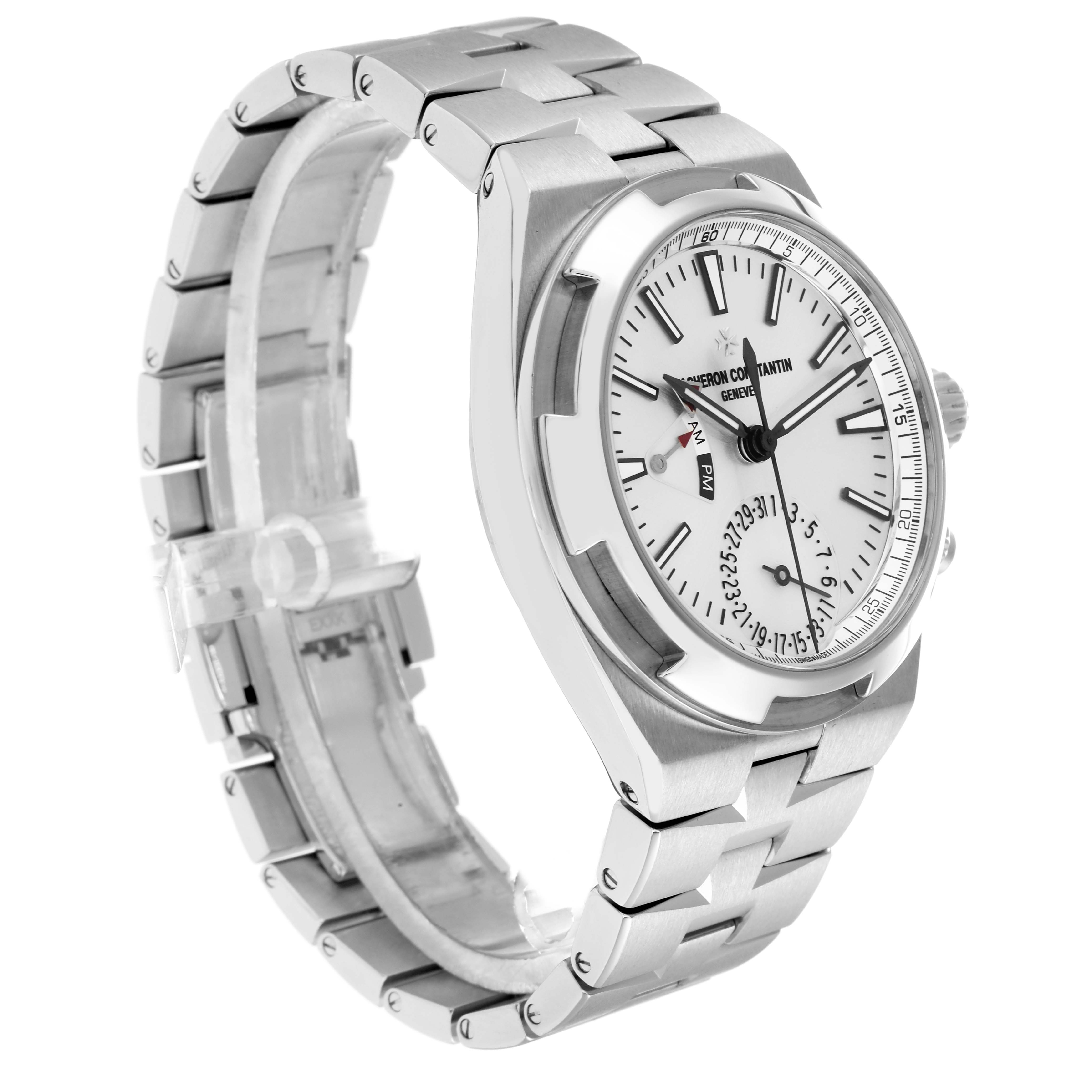 The Vacheron Constantin Overseas 7900V Men
s Stainless Steel Silver Dial watch is shown at a three-quarter angle, displaying the face, bezel, crown, and bracelet.
