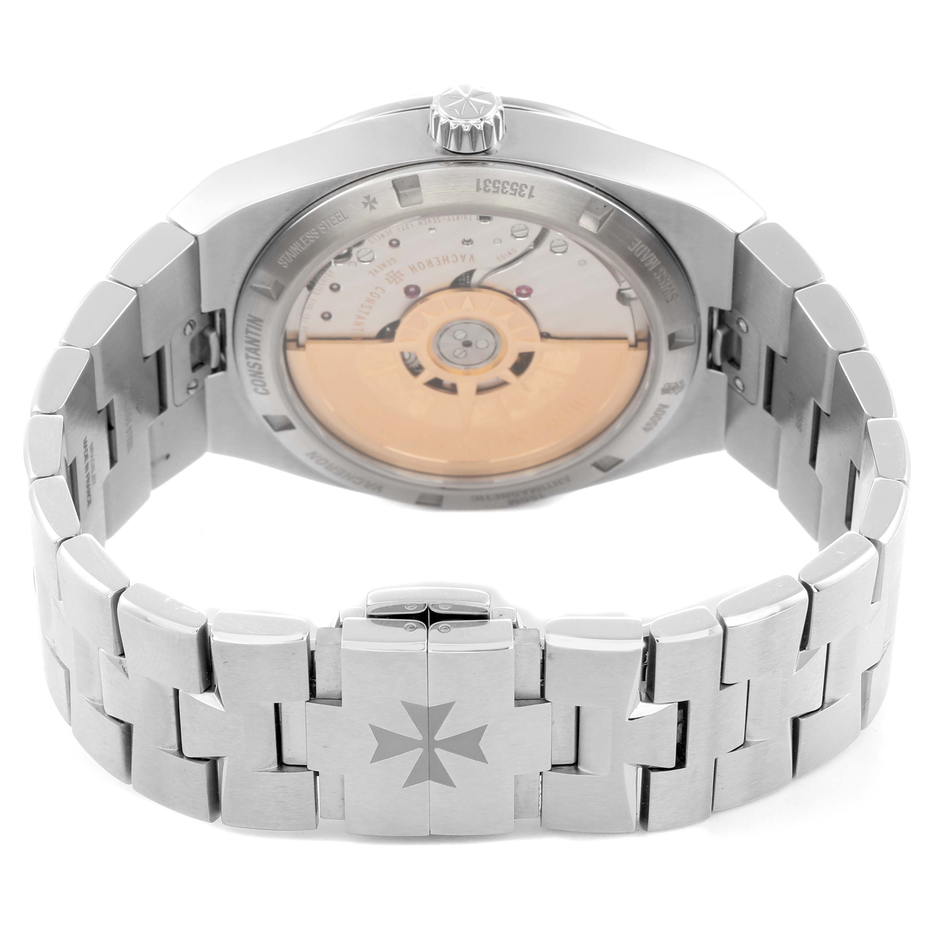 The image shows the Vacheron Constantin Overseas 4500V Men
s Stainless Steel Silver Dial watch from the back, displaying the movement and bracelet with clasp.