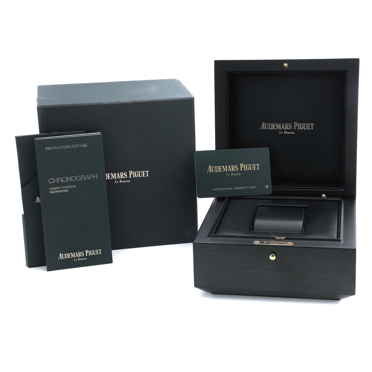 The image shows the Audemars Piguet Royal Oak Offshore 26400IO.OO.A004CA.01 Men's Titanium Grey Dial packaging, including the box, warranty card, and instruction manuals.