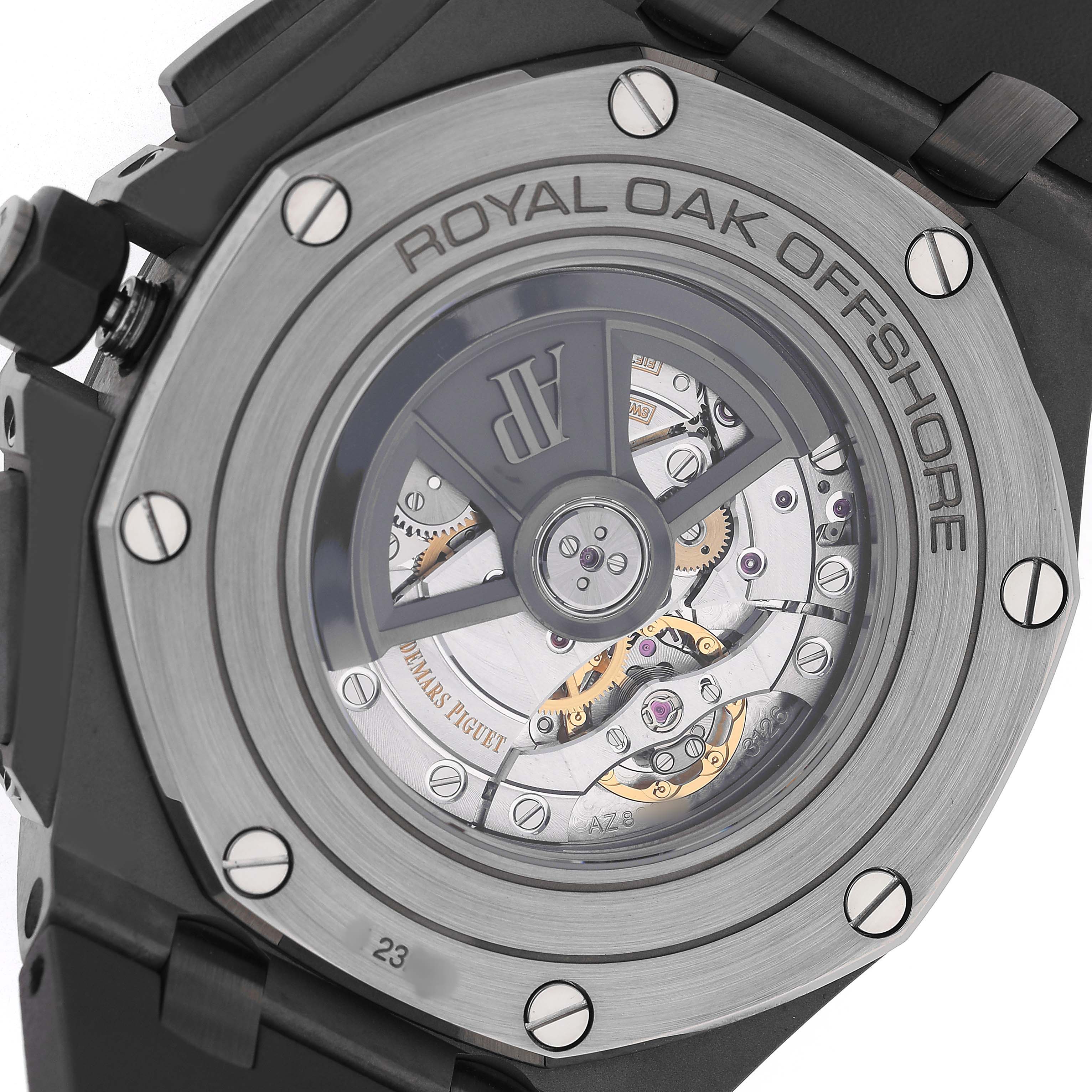 The image shows the back view of the Audemars Piguet Royal Oak Offshore 26400IO.OO.A004CA.01 Men's Titanium Grey Dial, highlighting its movement and caseback design.