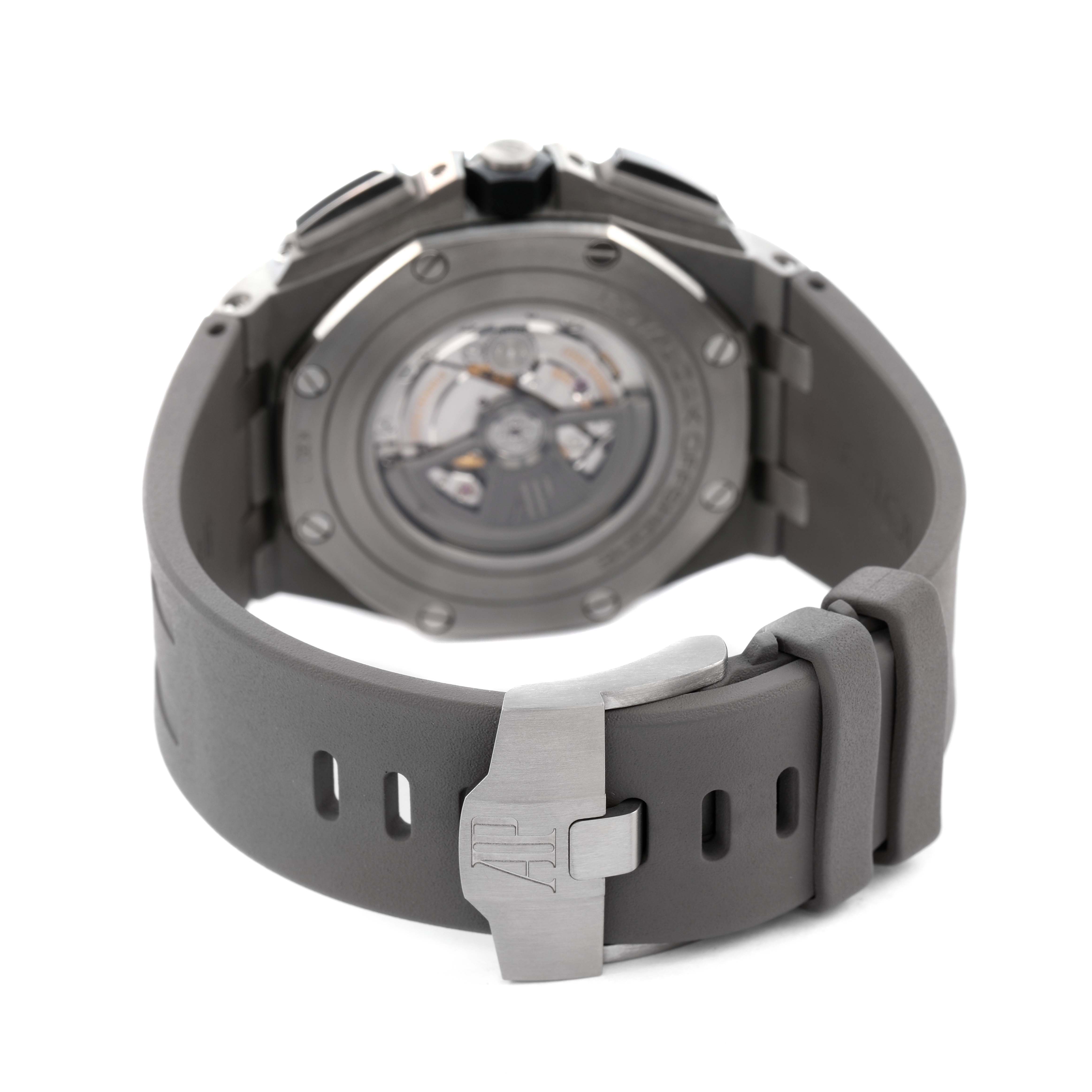 The Audemars Piguet Royal Oak Offshore 26400IO.OO.A004CA.01 Men's Titanium Grey Dial watch is shown from the back, highlighting the case back, movement, and clasp.
