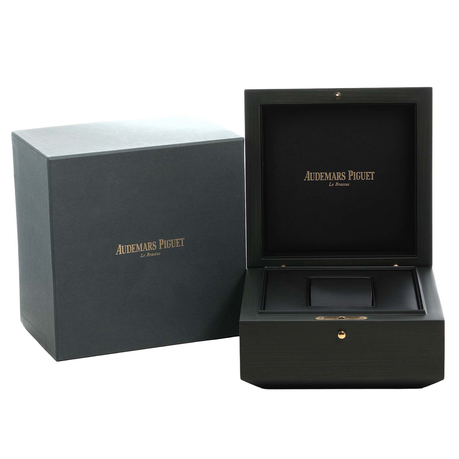 The image shows the opened box and outer packaging for a Royal Oak watch by Audemars Piguet, highlighting the presentation materials.