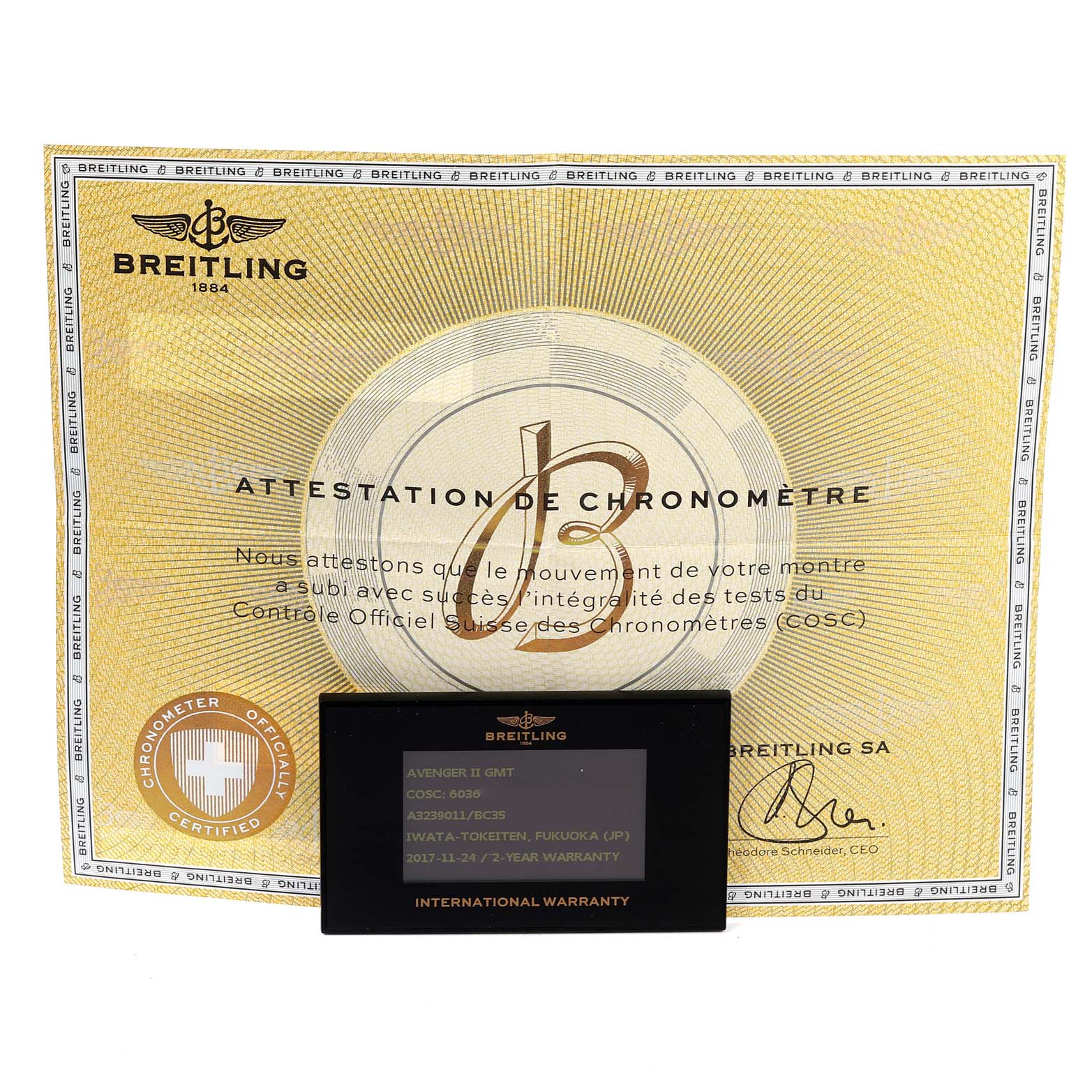 Displayed are the Breitling Avenger A3239011-C872-170A Men's Stainless Steel Black Dial A3239011-C872-170A Men's Stainless Steel Black Dial model's chronometer certification and an international warranty card.