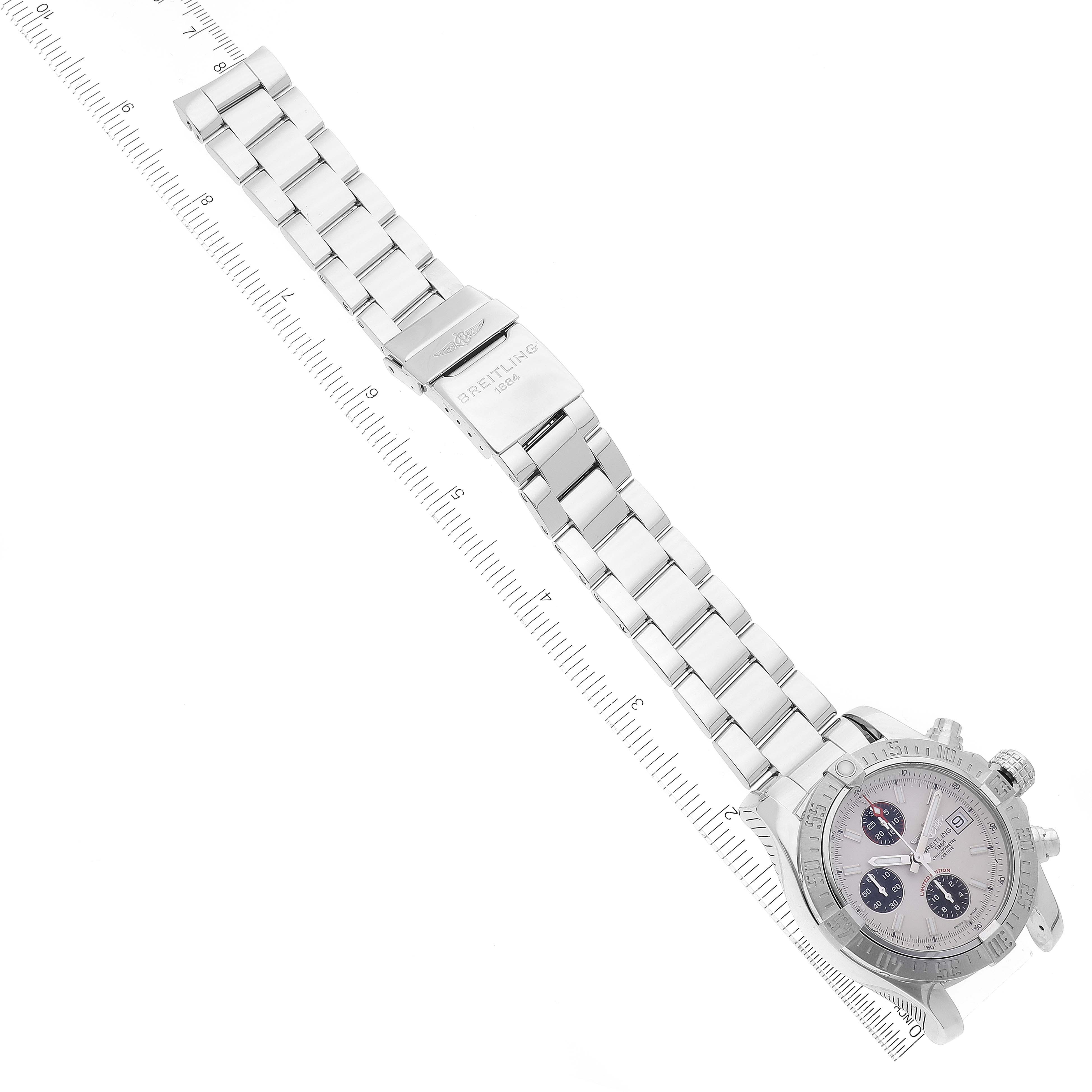 This image shows a Breitling Avenger A13381 Men
s Stainless Steel White Dial A13381 Men
s Stainless Steel White Dial watch laid flat with a ruler to measure its length, including the face, bezel, and metal bracelet.