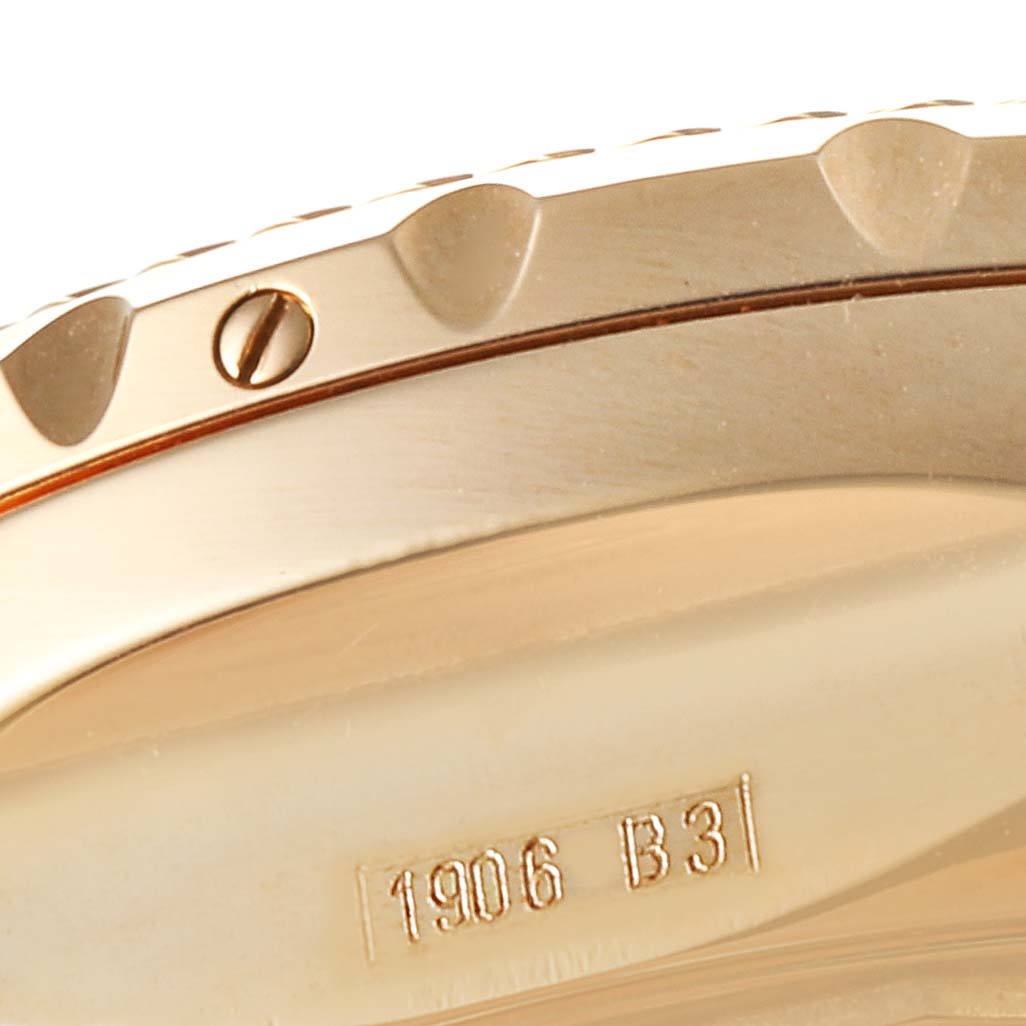 Close-up of the side and part of the bezel of a Breitling Bentley H13363 Men's Rose Gold Mother of Pearl Dial H13363 Men's Rose Gold Mother of Pearl Dial watch, showing a screw and engraved reference number.