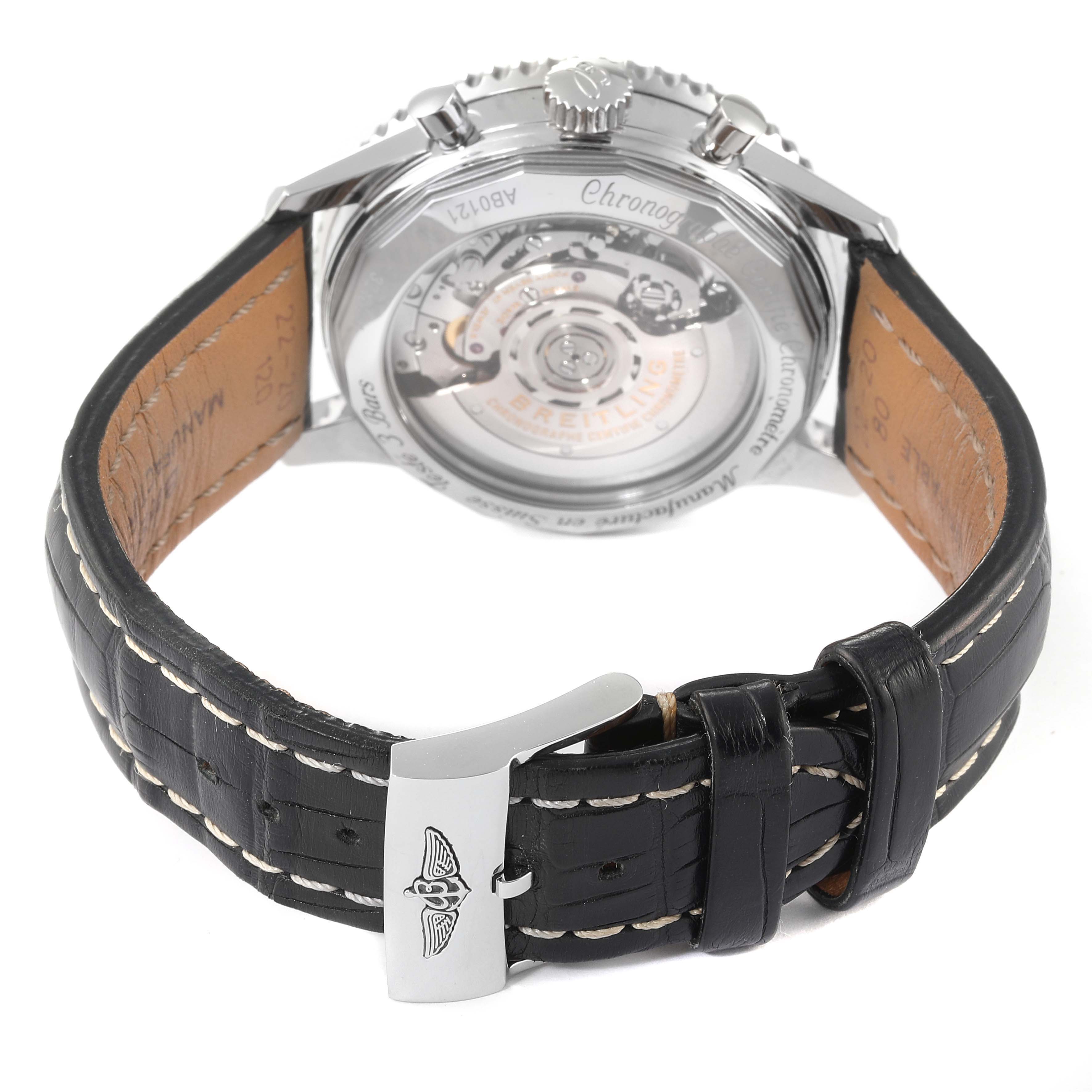 The image shows the back of a Breitling Navitimer AB0121C4-C920-731P Men's Stainless Steel Blue Dial AB0121C4-C920-731P Men's Stainless Steel Blue Dial watch, highlighting its movement and leather strap with stitching.