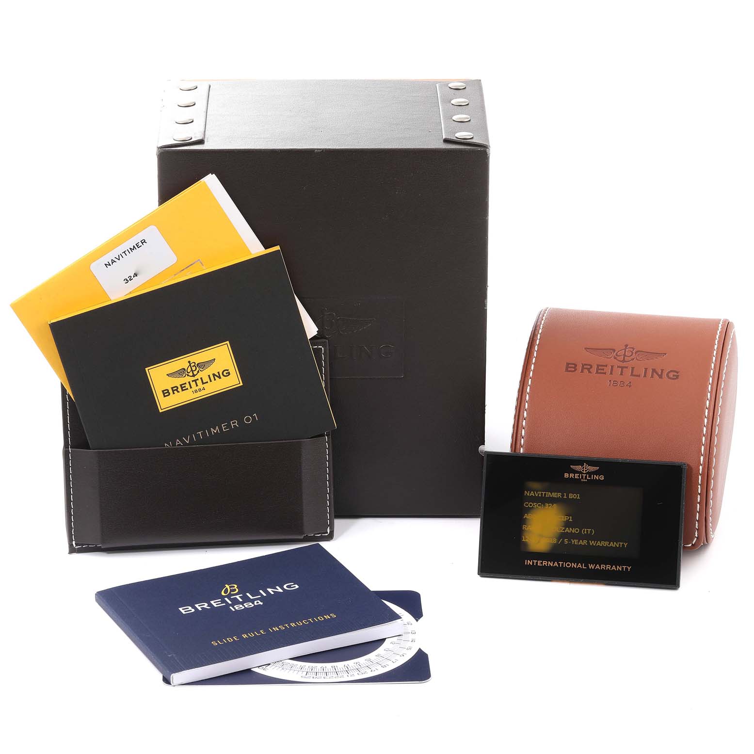 The image shows the accessory items of a Breitling Navitimer AB0121C4-C920-731P Men's Stainless Steel Blue Dial AB0121C4-C920-731P Men's Stainless Steel Blue Dial watch, including boxes, manuals, a leather pouch, and a warranty card.