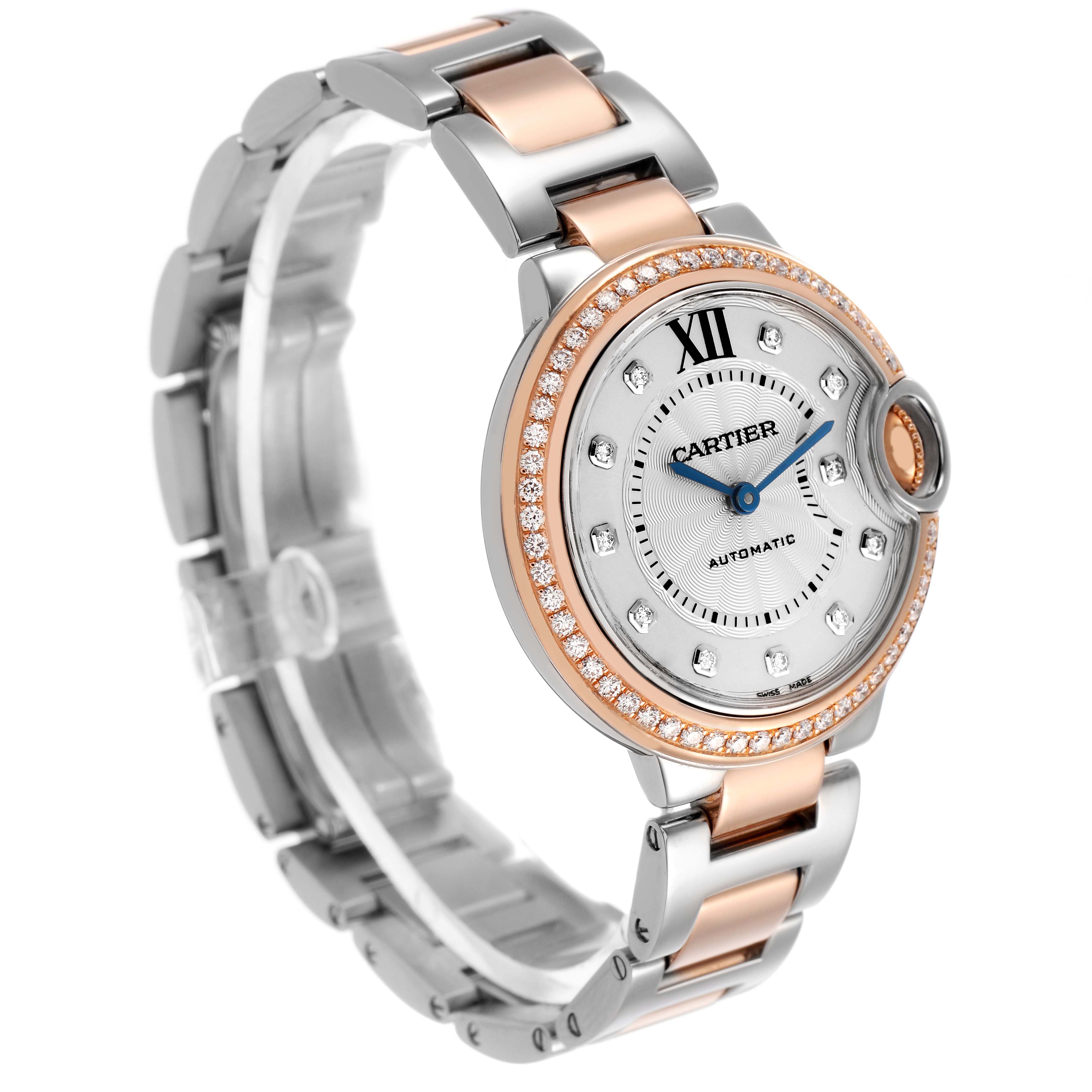 The Cartier Ballon Bleu WE902077 Women's Steel and Gold (two tone) Silver Dial watch is shown at a three-quarter angle, highlighting its bracelet, diamond bezel, and blue hands.