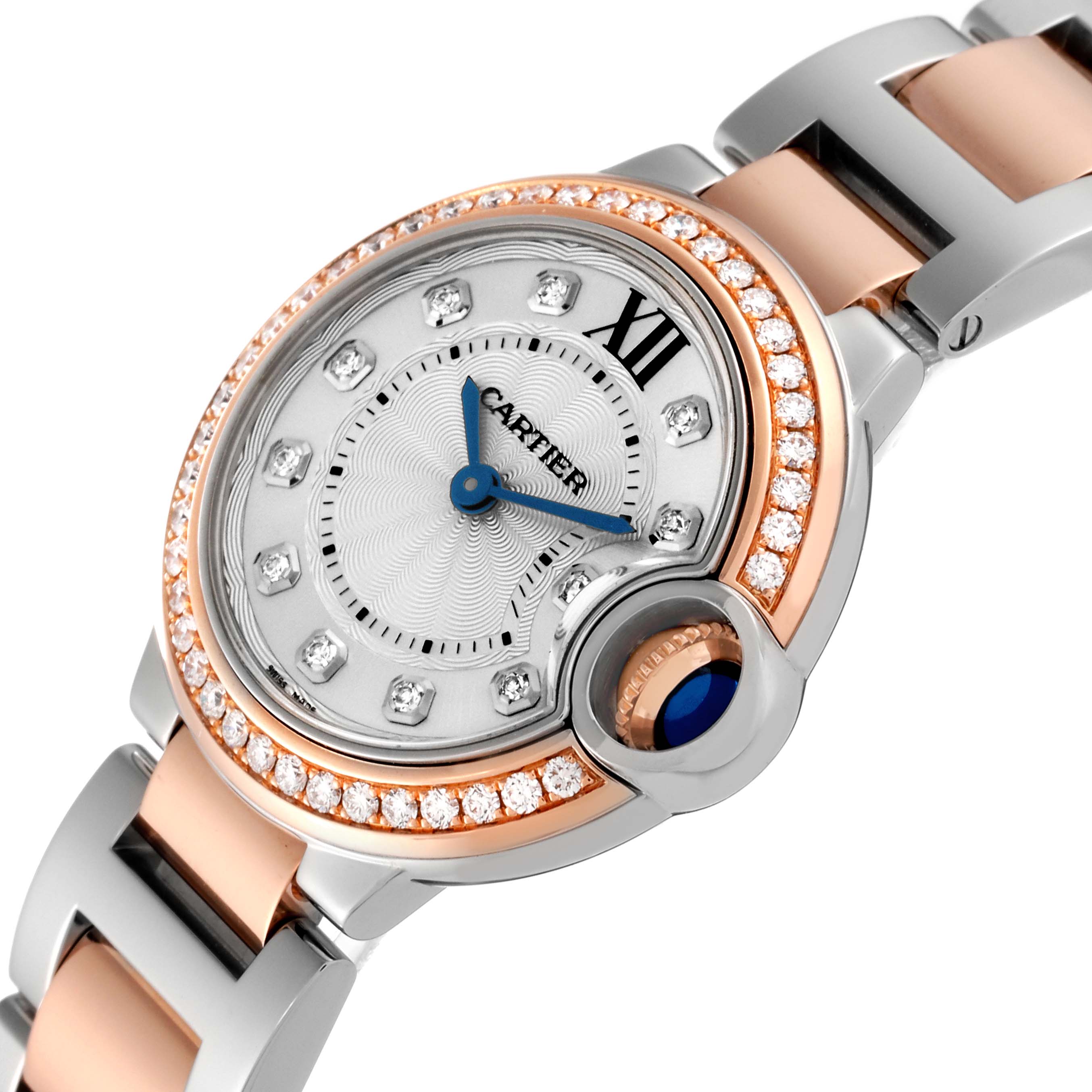 The image shows a close-up, angled view of the Cartier Ballon Bleu WE902076 Women's Steel and Gold (two tone) Silver Dial WE902076 Women's Steel and Gold (two tone) Silver Dial watch, highlighting the dial, diamonds, crown, and part of the bracelet.