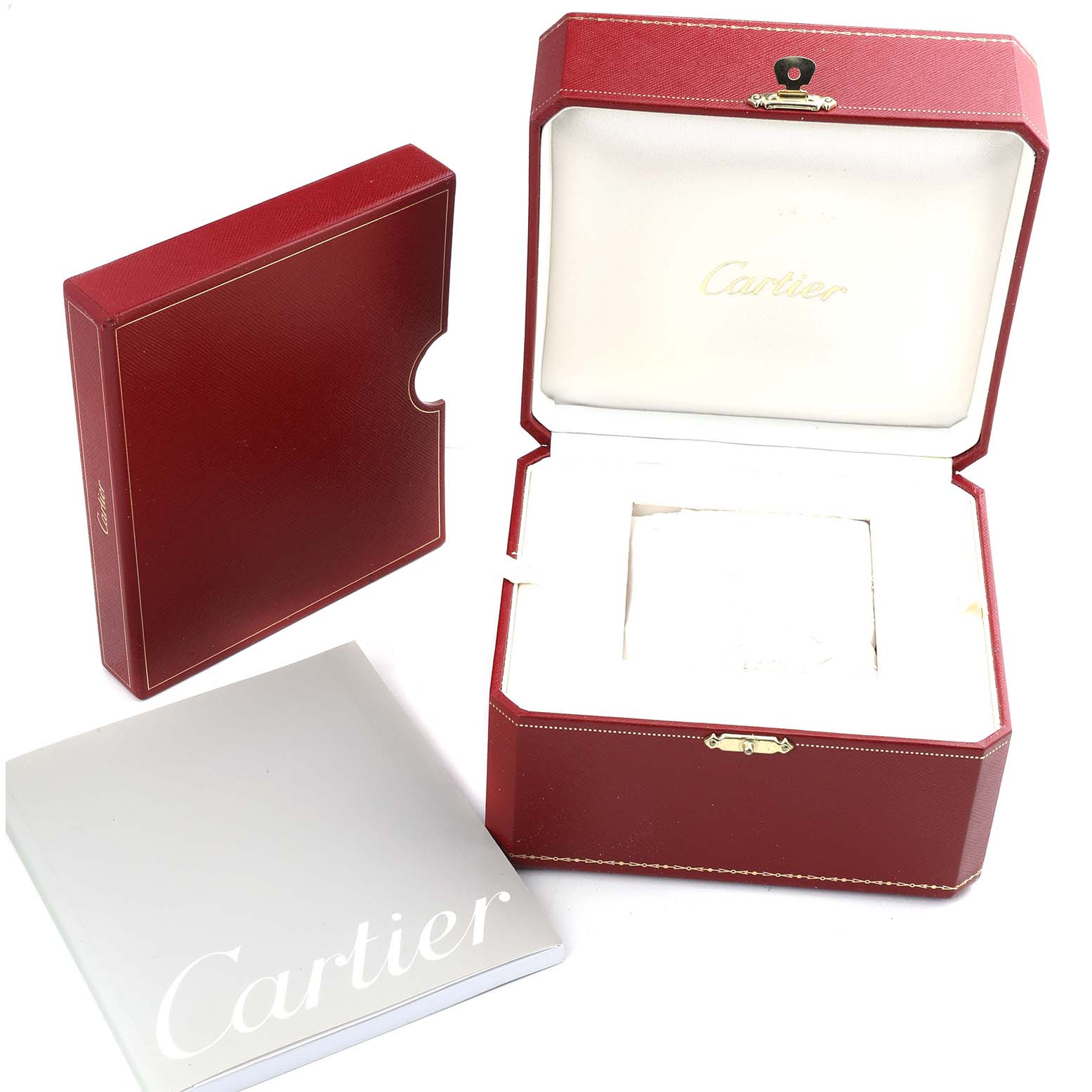 The image shows the Cartier Roadster W62016V3 Women's Stainless Steel Silver Dial watch box, outer packaging, and manual, all from a top angle.