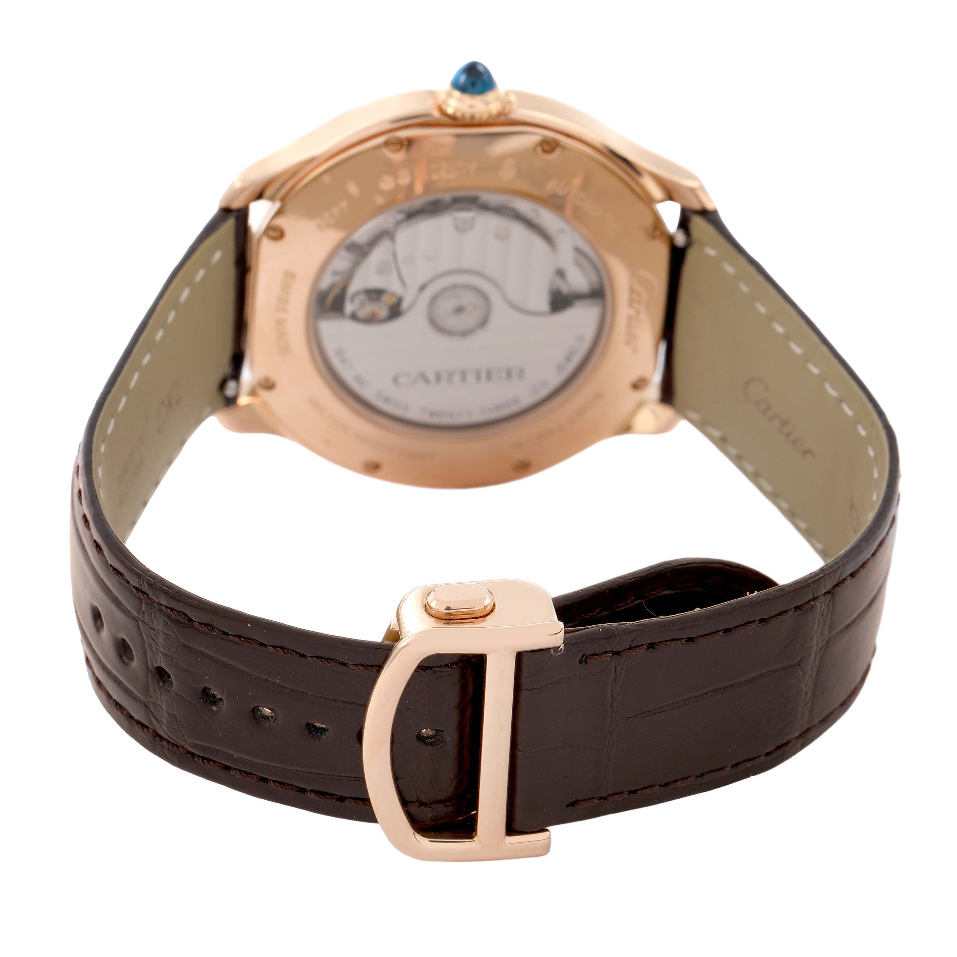 The image shows the back of the Cartier Ronde WGRN0011 Men's Rose Gold Silver Dial watch, featuring its case back and leather strap with a metal buckle.