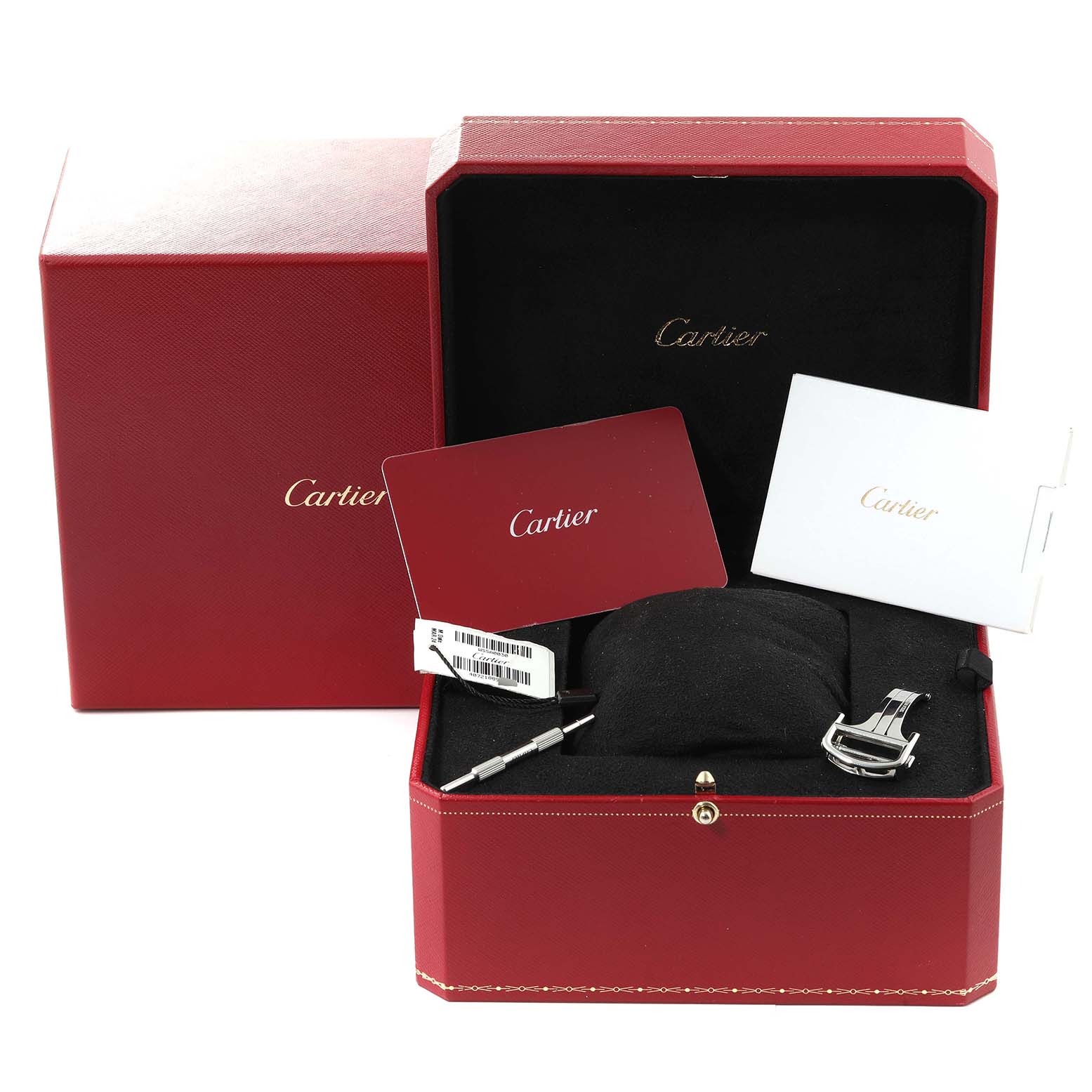 This image shows a Cartier Santos WSSA0030 Men's Stainless Steel Blue Dial WSSA0030 Men's Stainless Steel Blue Dial watch box with documentation, a strap tool, and clasp from a low angle.