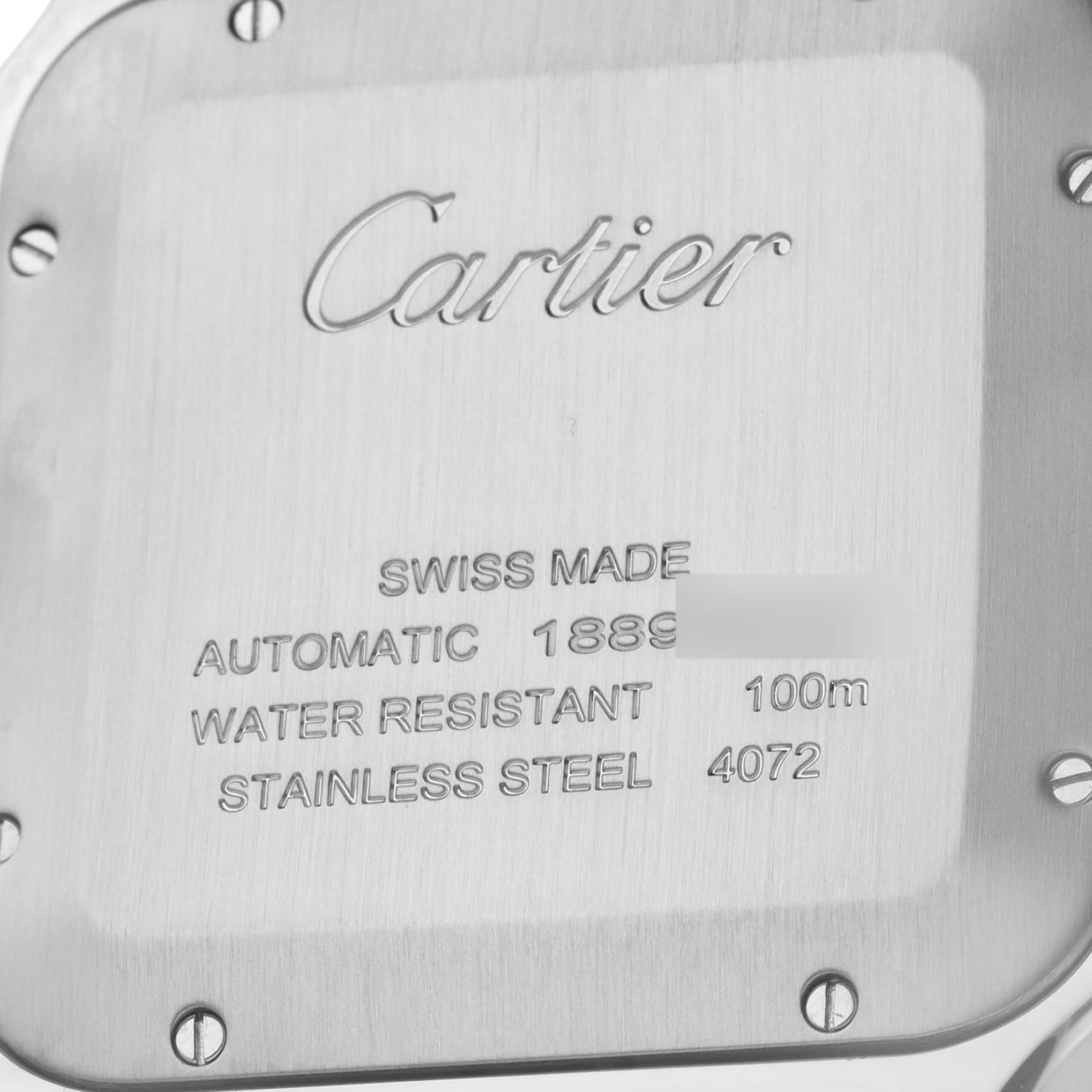 The image shows the back case of a Santos model by Cartier, highlighting details like "Swiss Made," "Automatic," and water resistance.