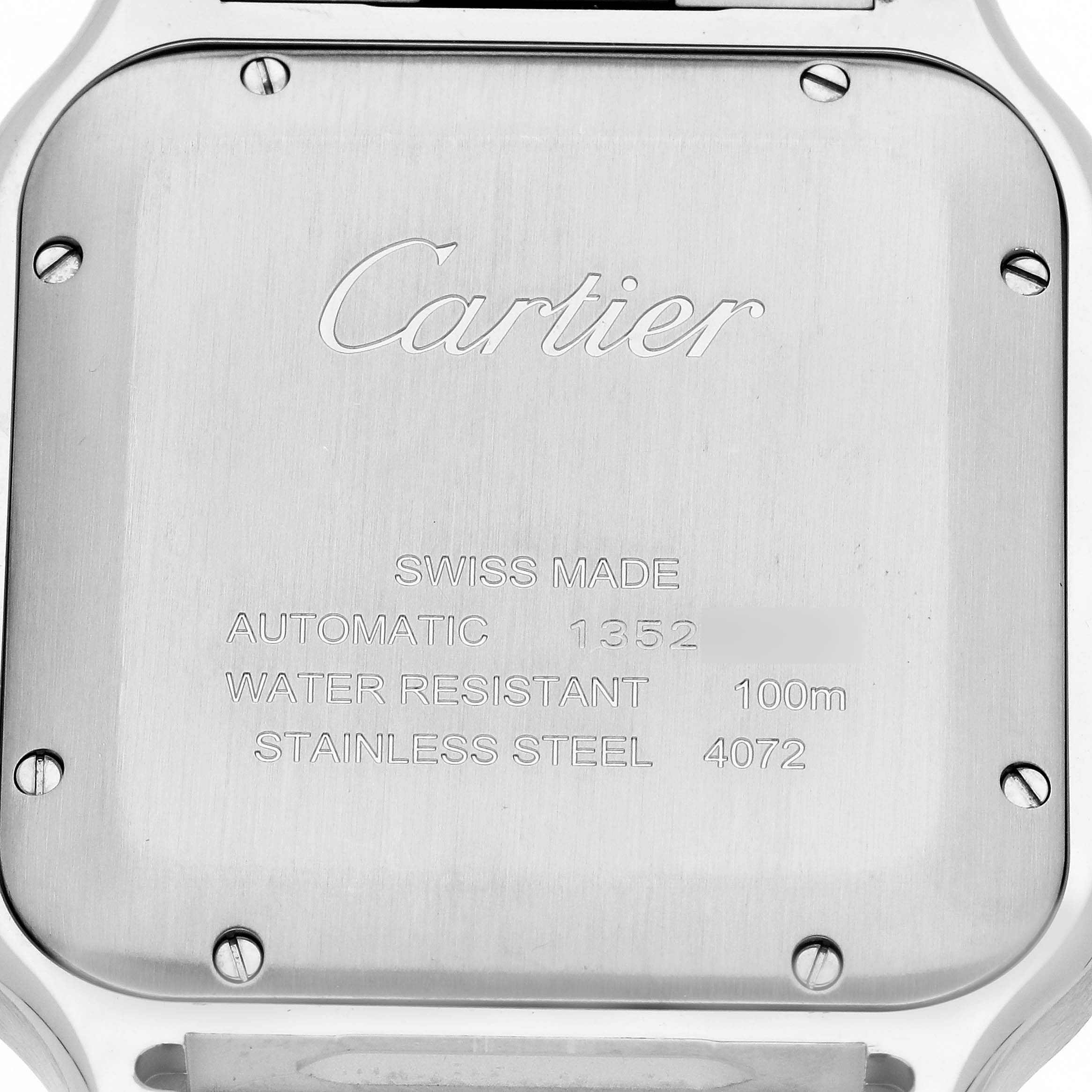 The image shows the case back of a Cartier Santos WSSA0018 Men
s Stainless Steel Silver Dial WSSA0018 Men
s Stainless Steel Silver Dial watch, highlighting details like "Cartier," "SWISS MADE," and "STAINLESS STEEL."