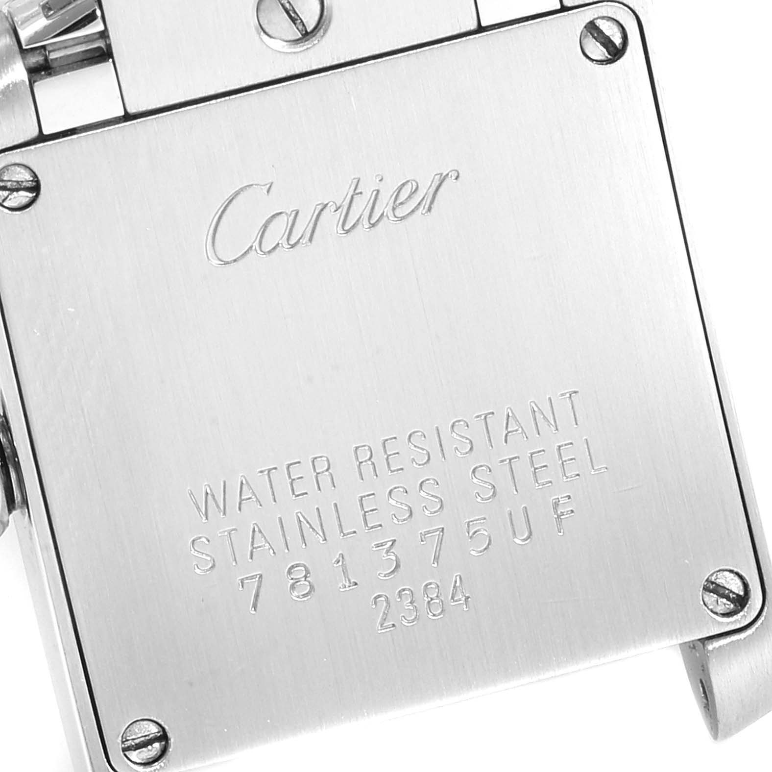 The image shows the back of a Cartier Tank Francaise W51007Q4 Women's Steel and Gold (two tone) Silver Dial W51007Q4 Women's Steel and Gold (two tone) Silver Dial watch, highlighting its engravings and screws.