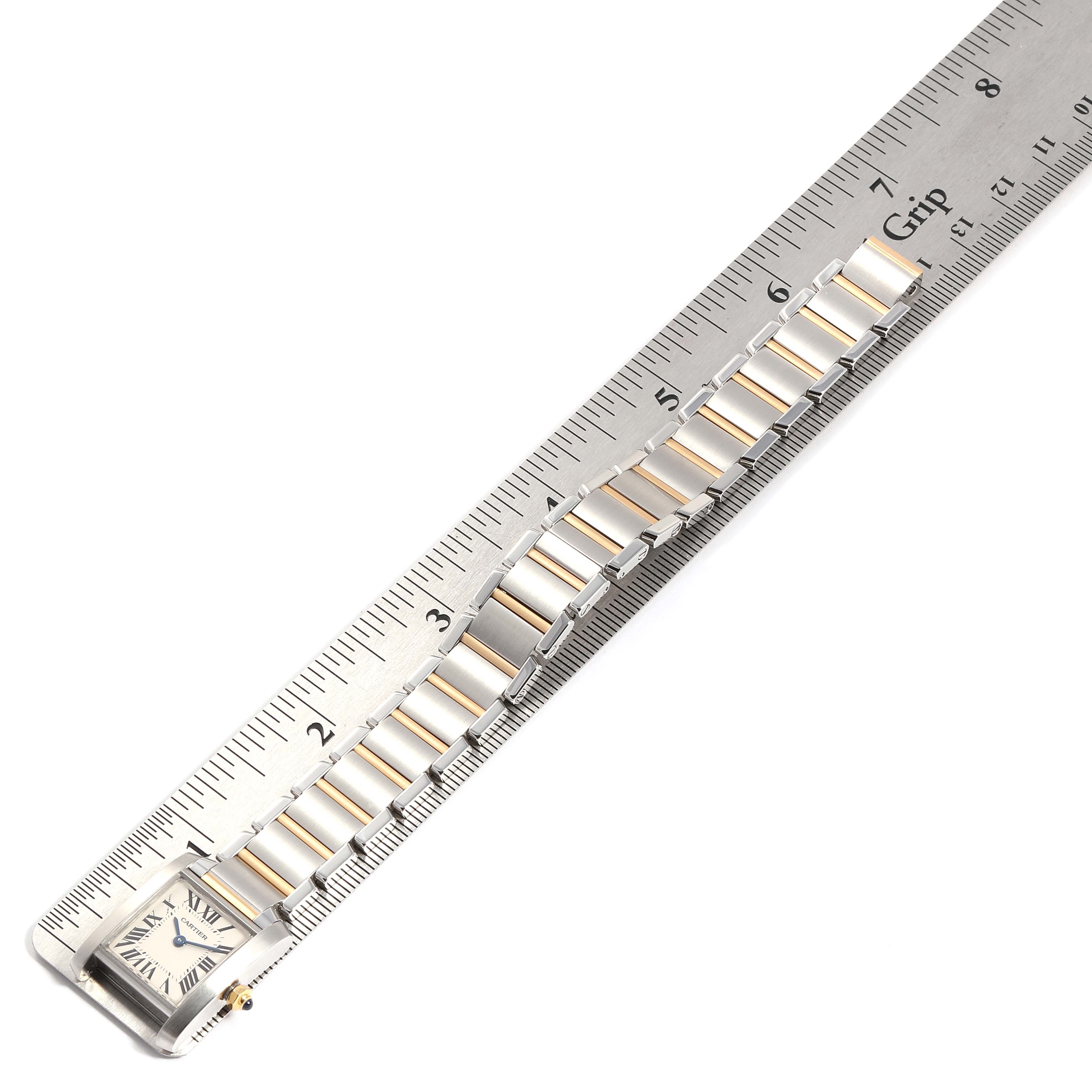 The Cartier Tank Française watch is shown from the front with a partial view of its bracelet and case.