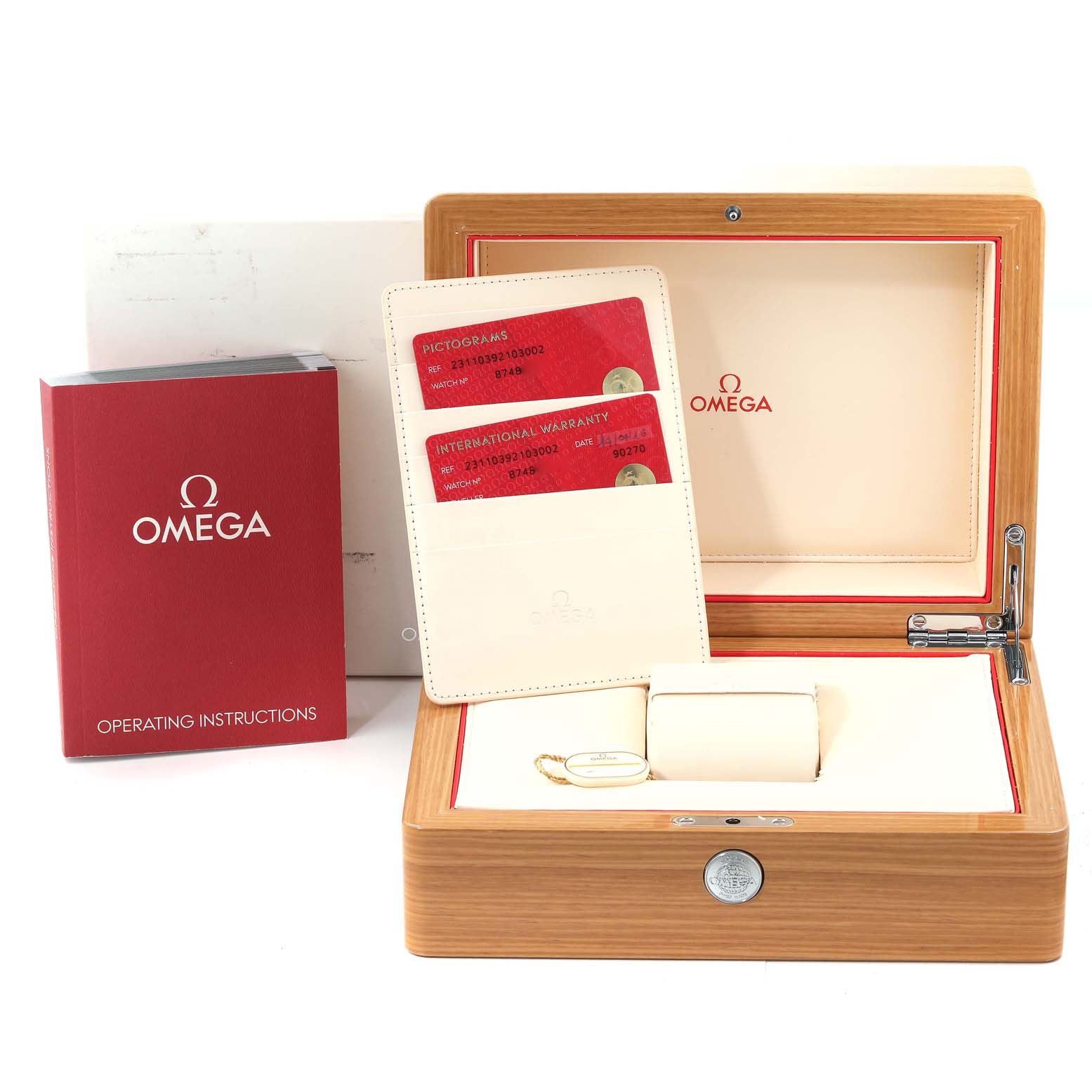 This Aqua Terra Omega watch set includes the watch box, warranty cards, an instruction manual, and a display pillow.