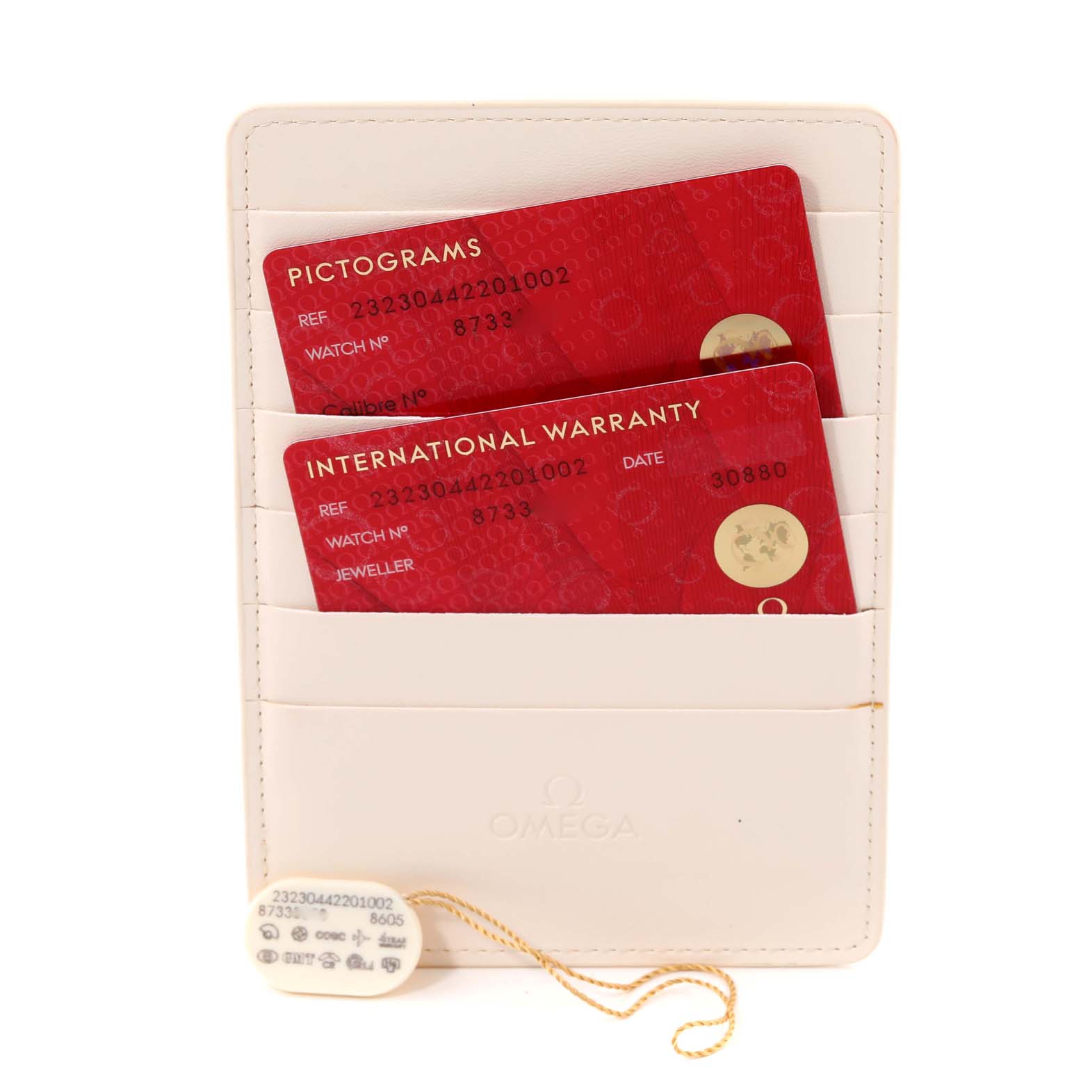 The image shows a front angle of an Omega Planet Ocean 232.30.44.22.01.002 Men's Stainless Steel Black Dial 232.30.44.22.01.002 Men's Stainless Steel Black Dial model's warranty cards and a white cardholder.