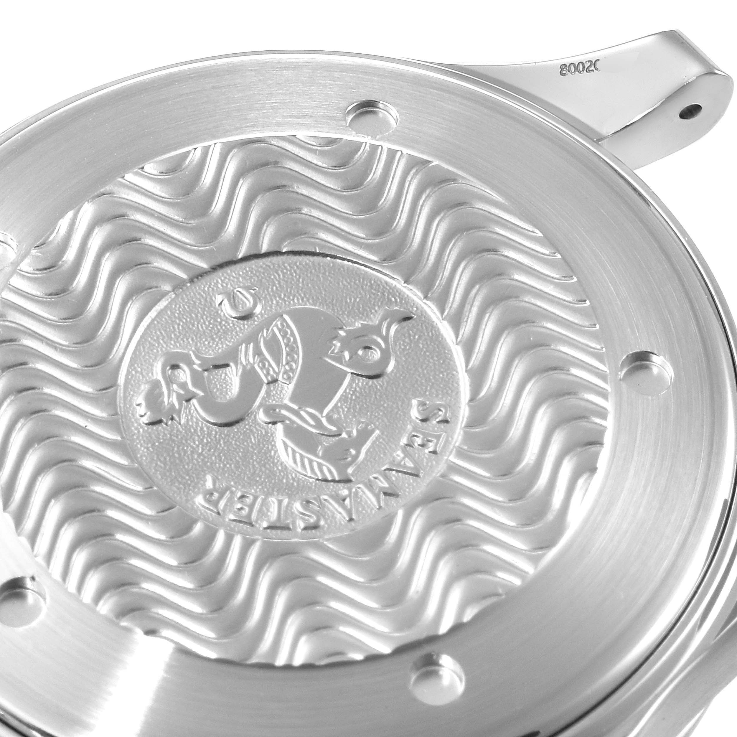 The image shows the case back of an Omega Seamaster 2455.50.00 Men's Steel and Gold (two tone) Black Dial 2455.50.00 Men's Steel and Gold (two tone) Black Dial watch, featuring an embossed seahorse emblem and wave pattern design.