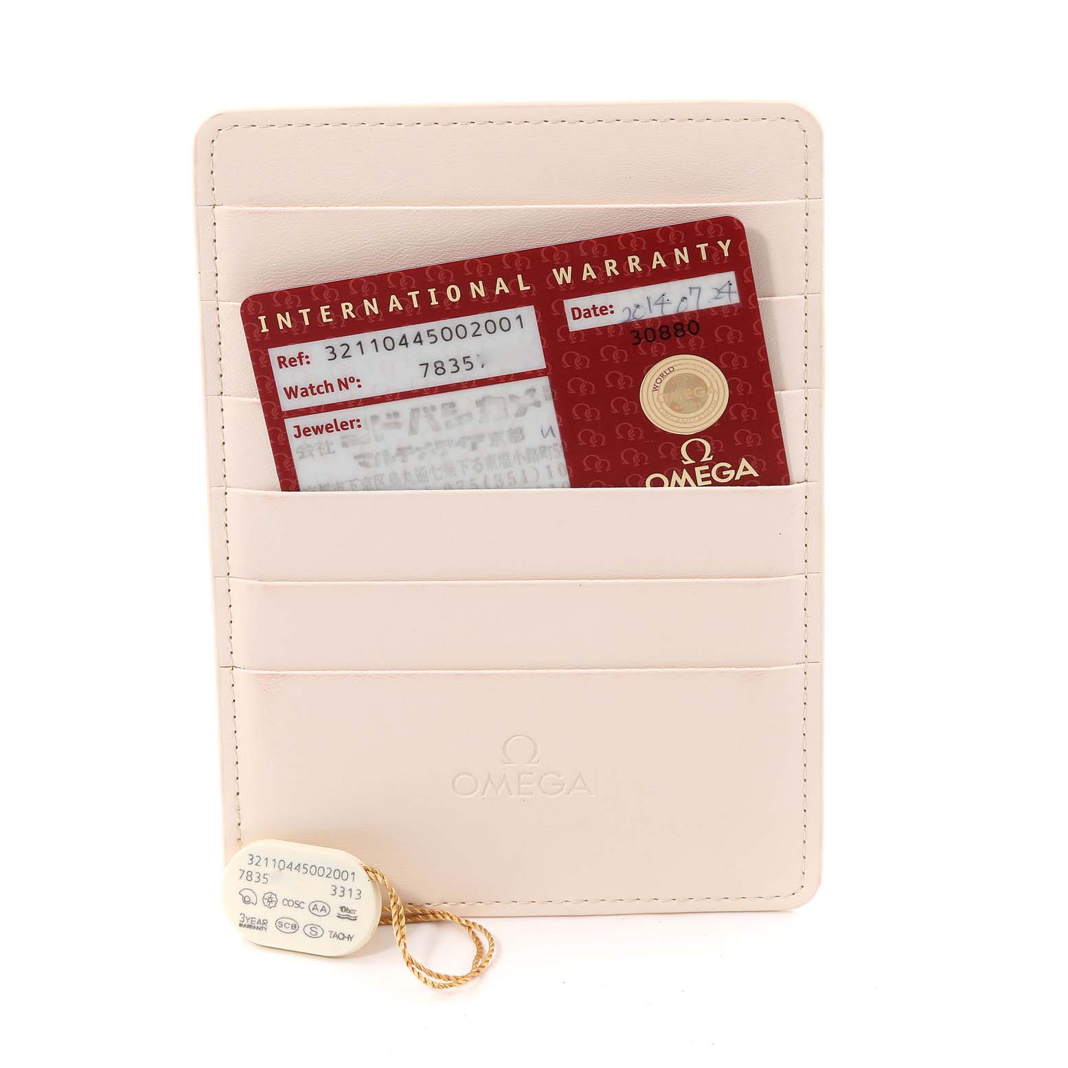 The image shows the international warranty card and tag of an Omega Speedmaster 321.10.44.50.02.001 Men
s Stainless Steel Silver Dial 321.10.44.50.02.001 Men
s Stainless Steel Silver Dial watch displayed inside a card holder.