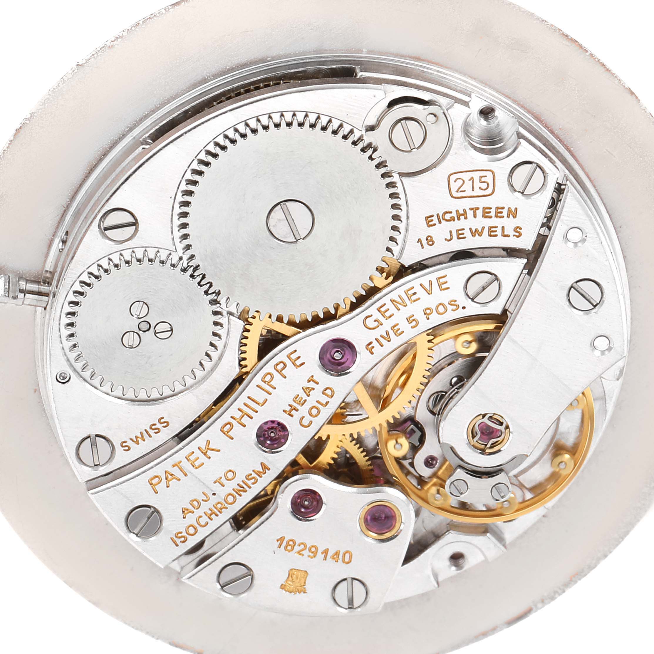The image shows a close-up of the movement of a Patek Philippe Calatrava 3919 Men's Yellow Gold White Dial 3919 Men's Yellow Gold White Dial watch, revealing its intricate inner gears and mechanisms.