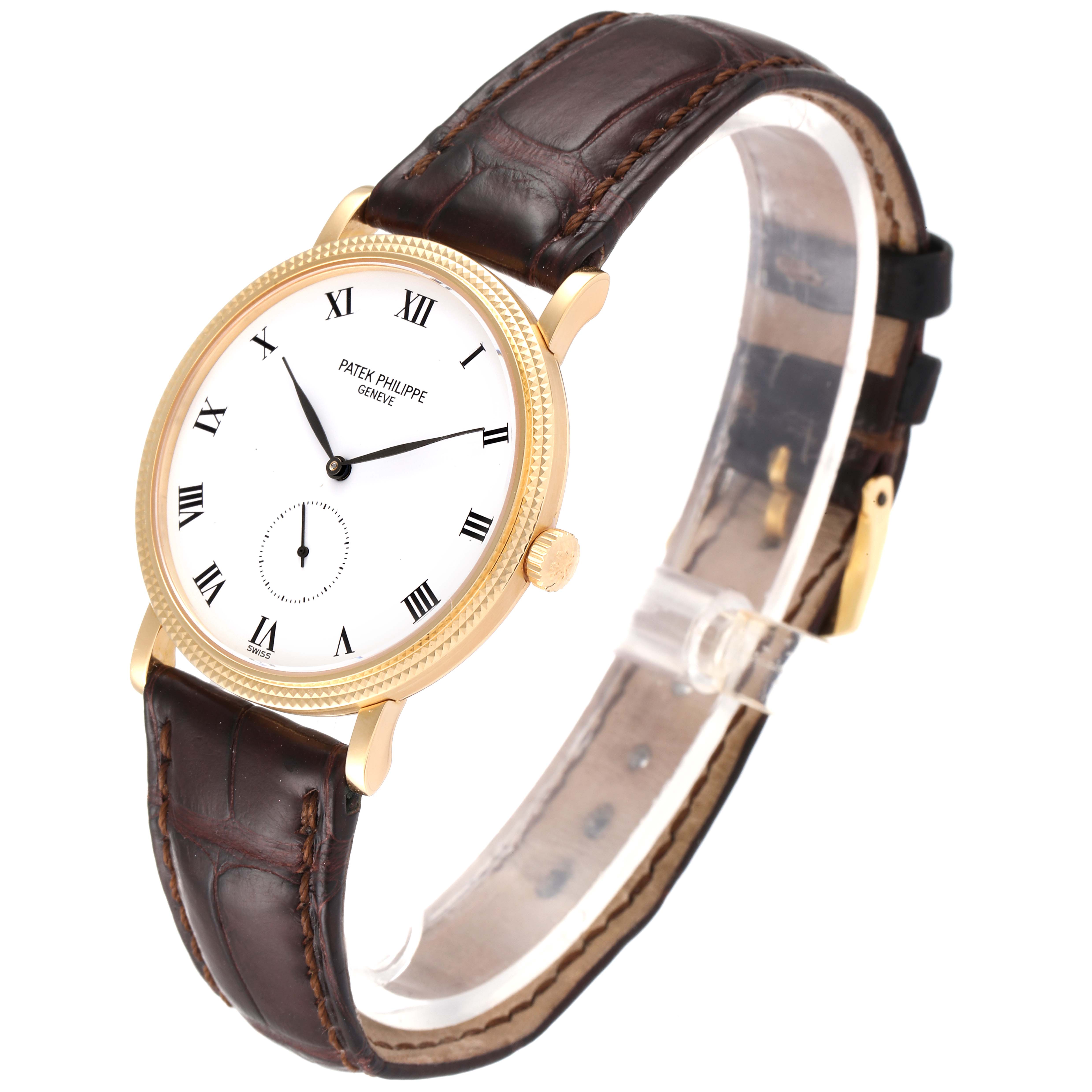 The Patek Philippe Calatrava 3919 Men's Yellow Gold White Dial 3919 Men's Yellow Gold White Dial watch shown is angled to display the face, bezel, crown, and leather strap.