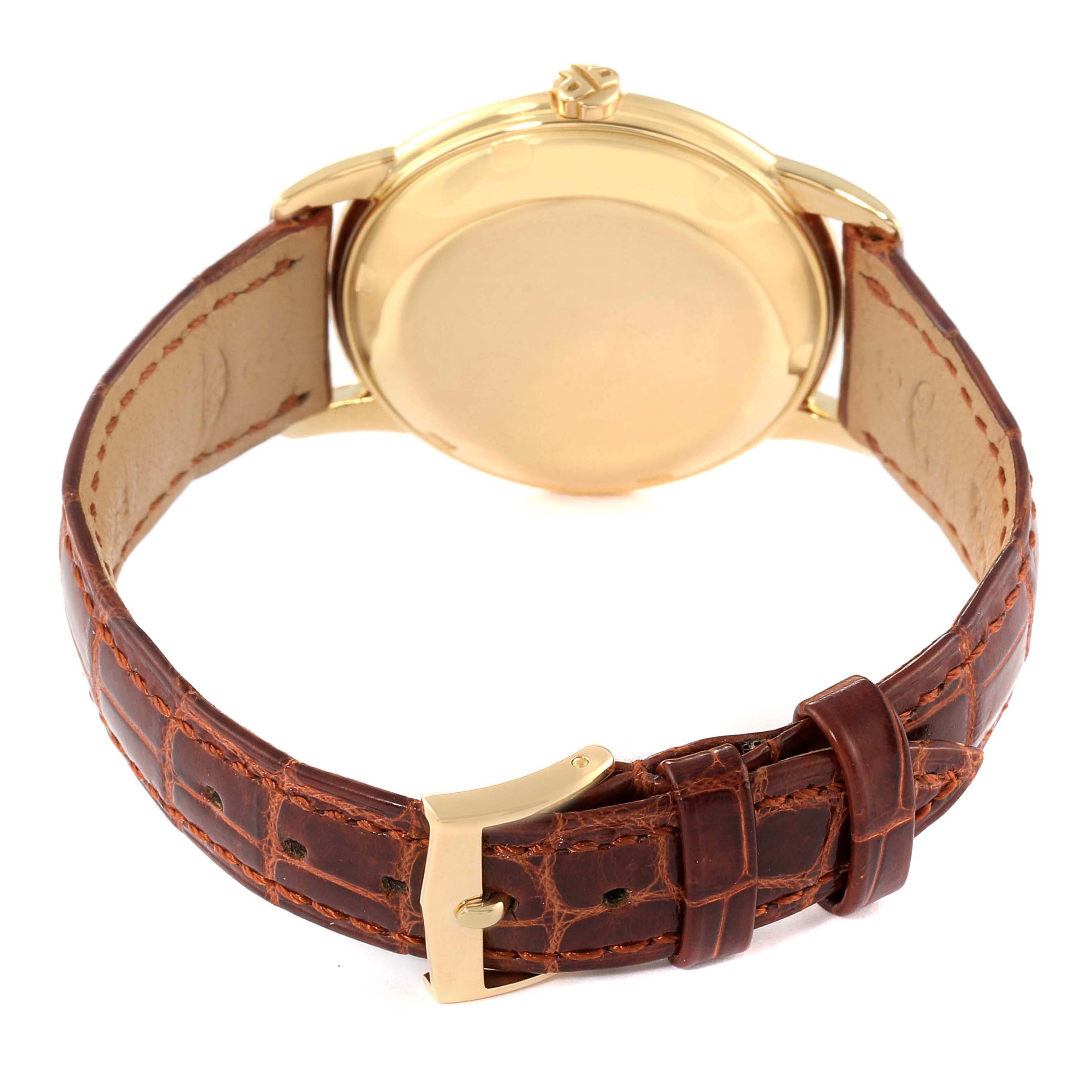 The image shows the back view of the Vintage Patek Philippe watch, highlighting the caseback, crown, and brown leather strap with the buckle.