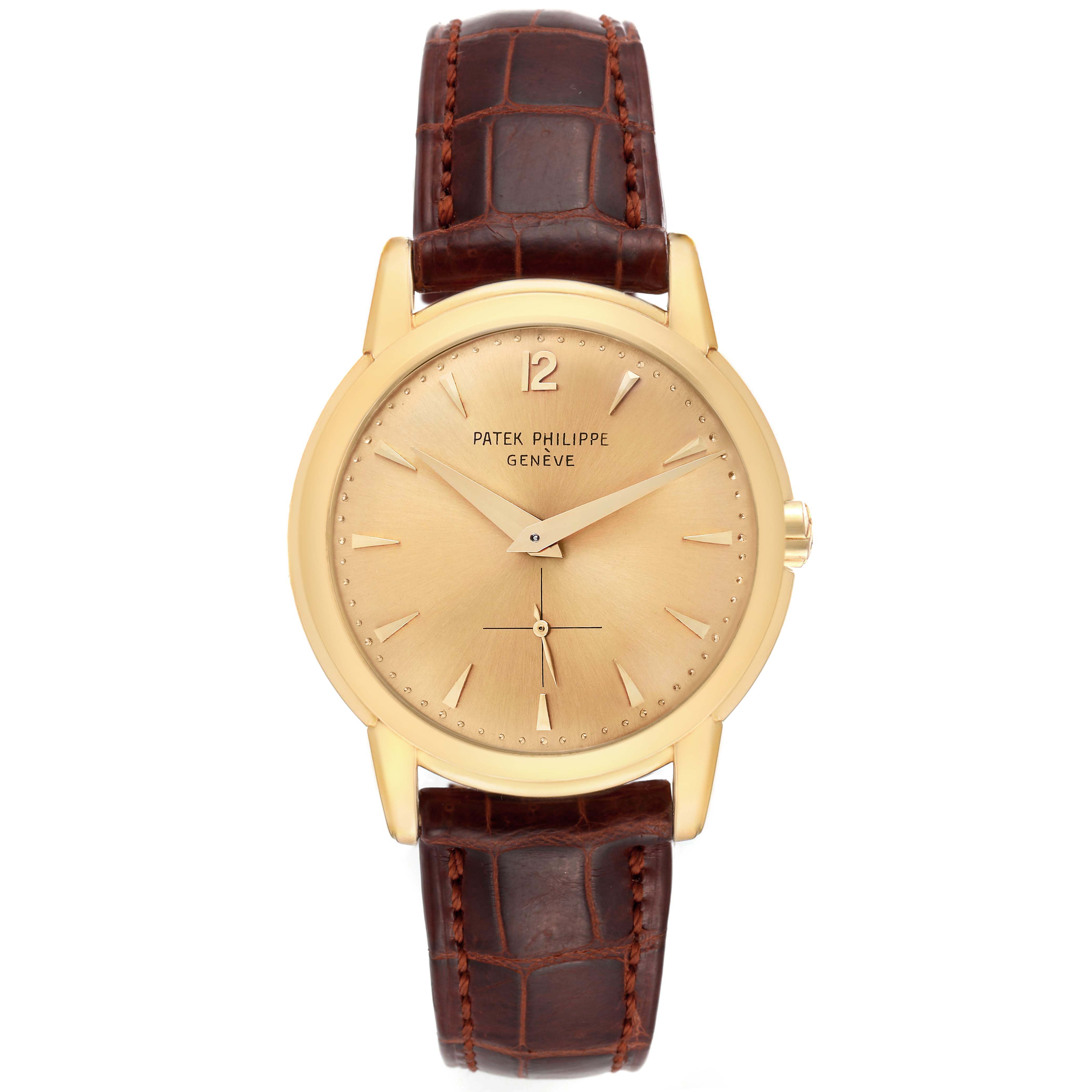 This image shows a frontal view of a Patek Philippe Vintage watch, highlighting its gold face, leather strap, and minimalist markers.