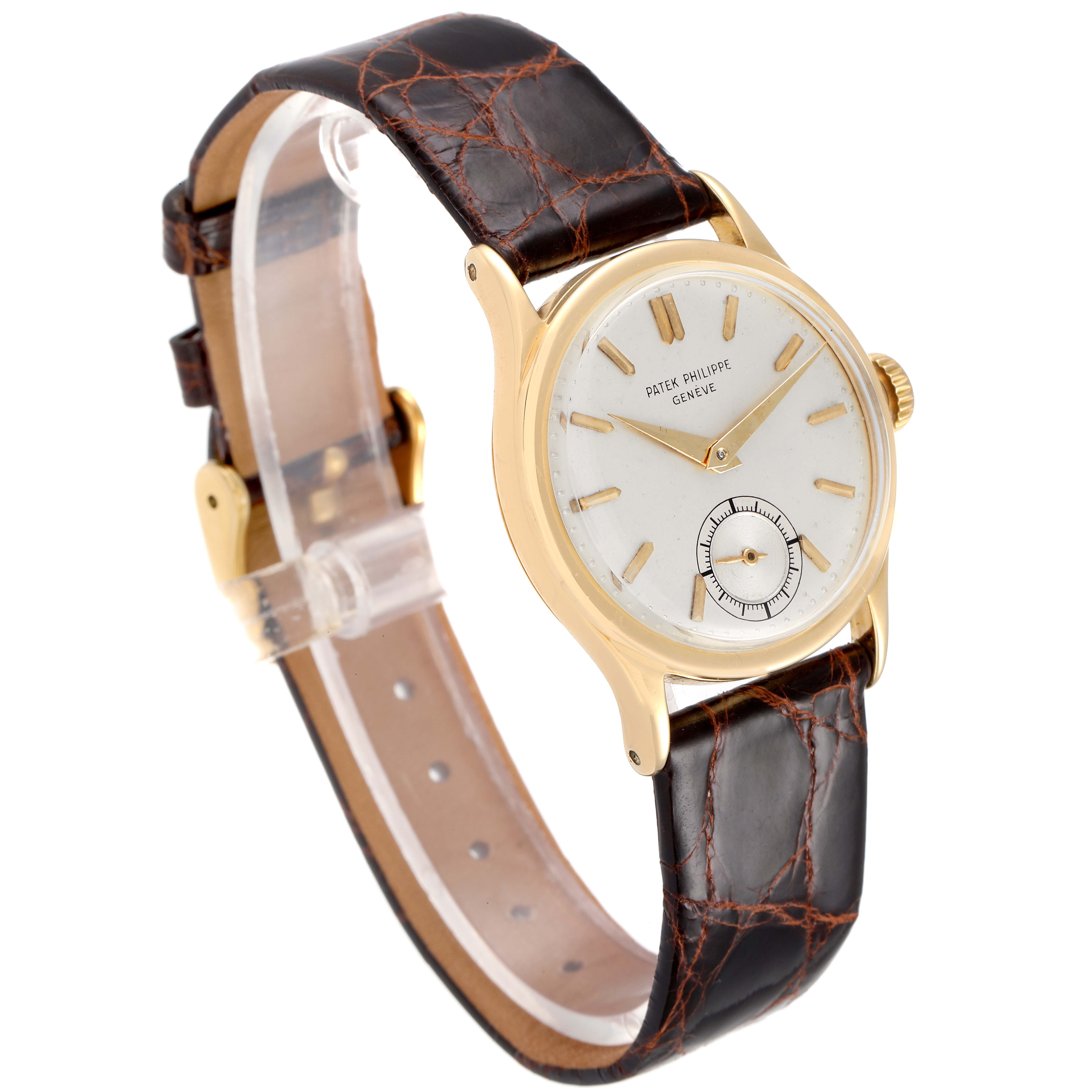 The Vintage Patek Philippe watch is shown at a slight angle, displaying its face, hands, crown, case, and leather strap.