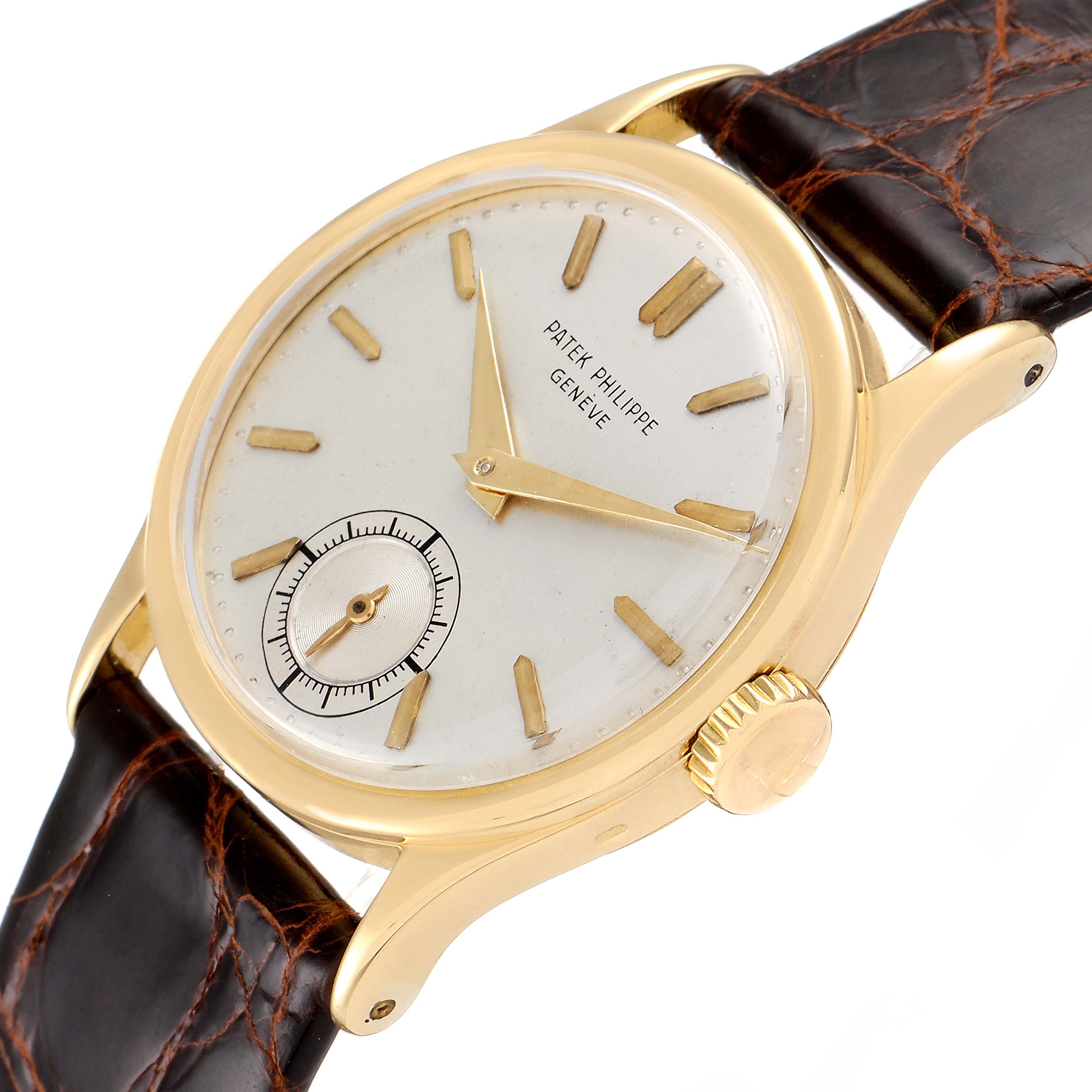 The image shows a Vintage Patek Philippe watch from an angled view, highlighting the dial, crown, hands, case, and leather strap.