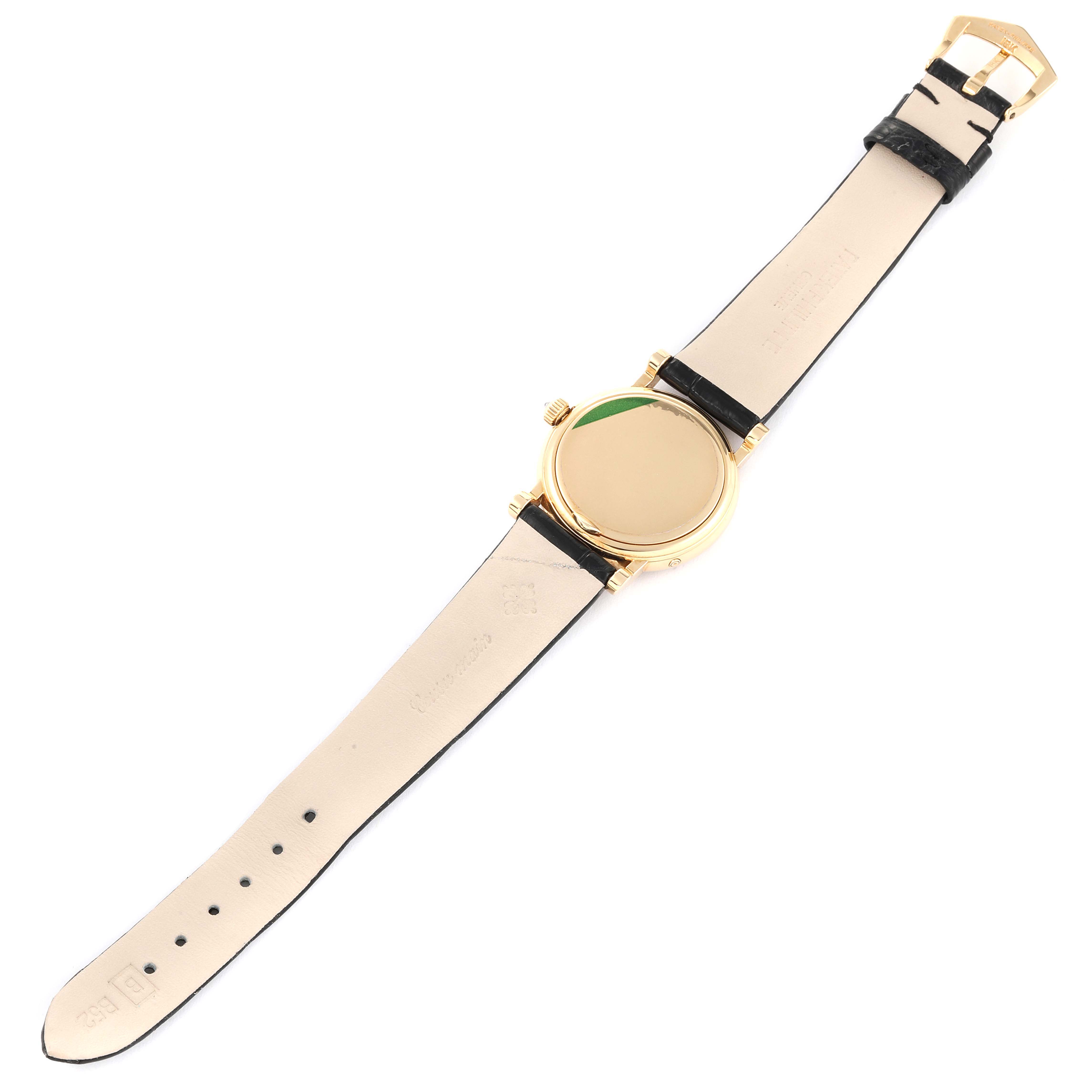 This image shows the back view of a Patek Philippe Calatrava 4858J - 010 Women's Yellow Gold Brown Dial 4858J - 010 Women's Yellow Gold Brown Dial watch, highlighting the strap, buckle, and case back.