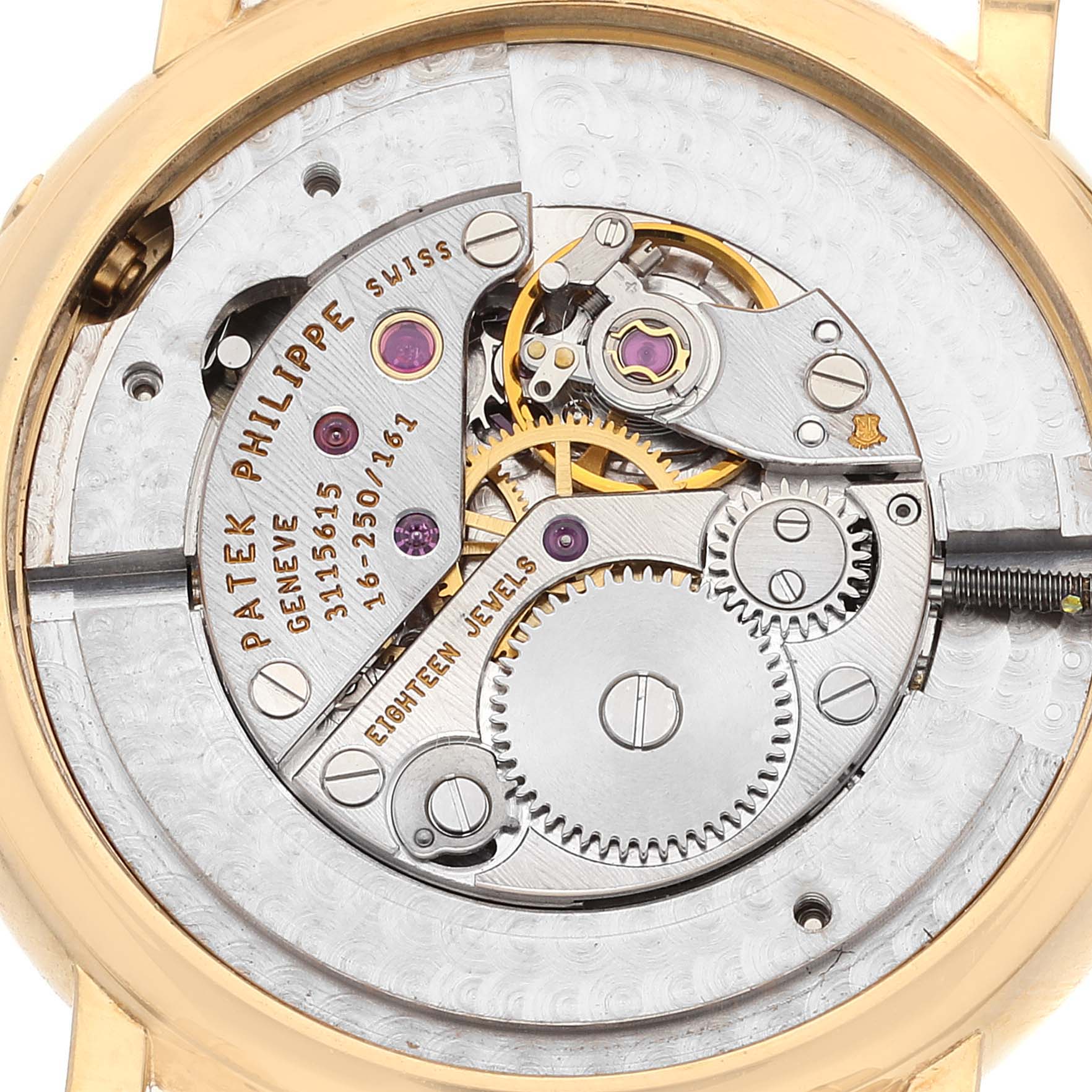 The image shows a close-up view of the movement and internal mechanisms of the Patek Philippe Calatrava 4858J - 010 Women's Yellow Gold Brown Dial 4858J - 010 Women's Yellow Gold Brown Dial watch.