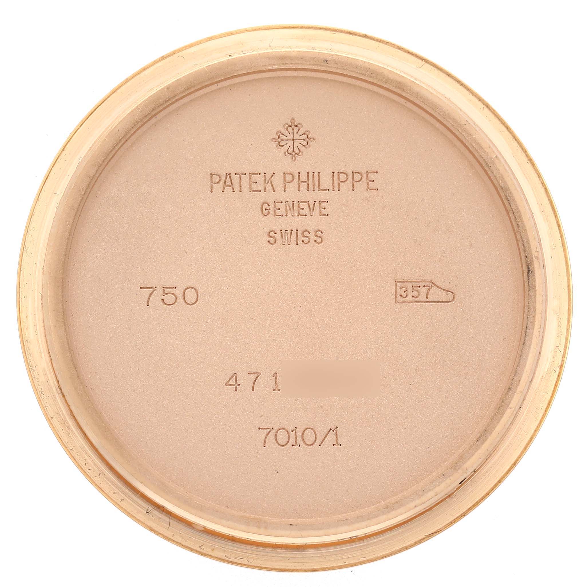 The image shows the inside of the case back of a Patek Philippe Nautilus 7010R Women's Rose Gold Silver Dial watch, with engravings of brand details and model numbers.