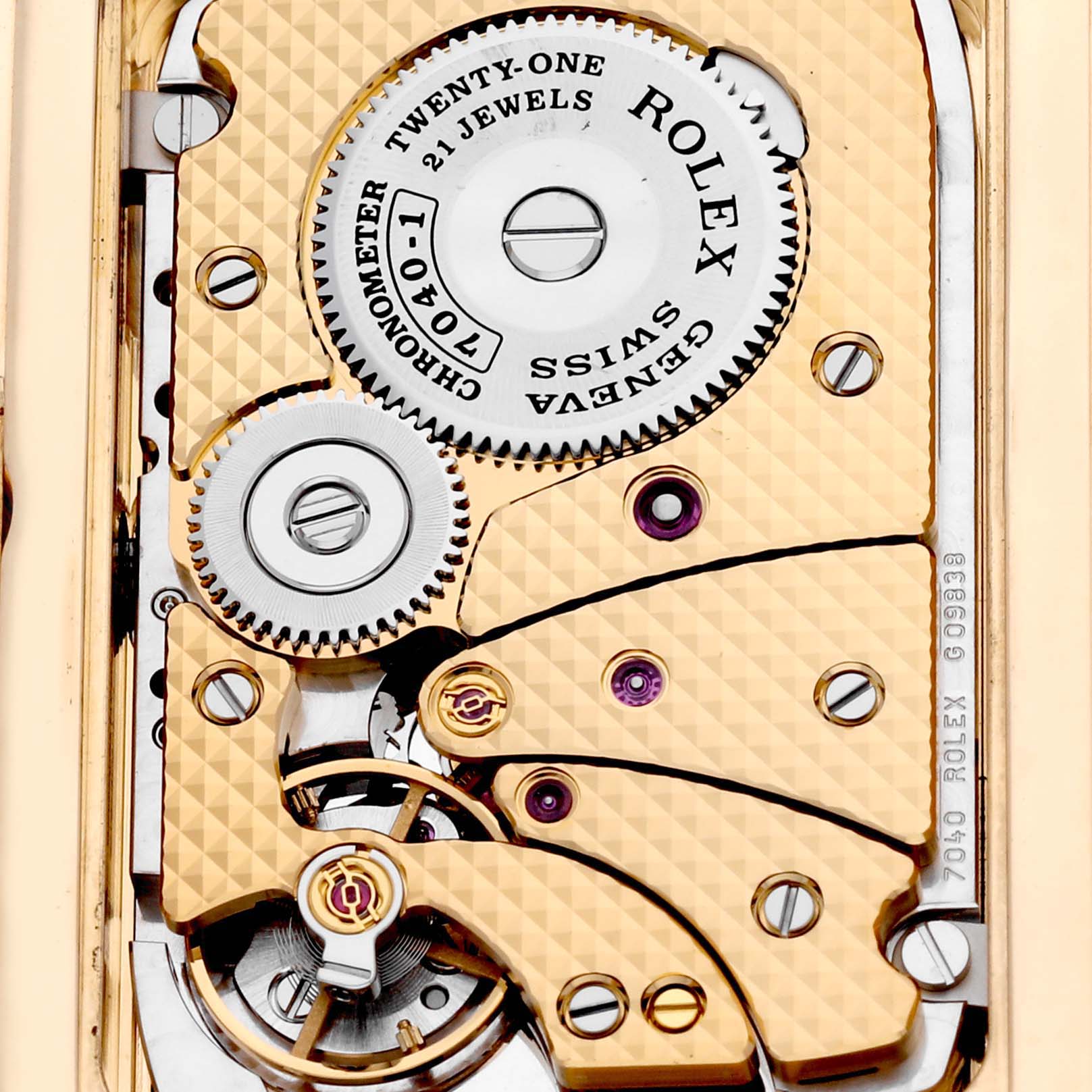 The image shows the internal mechanism of a Rolex Cellini 5440/8 Men's Yellow Gold Champagne Dial 5440/8 Men's Yellow Gold Champagne Dial watch, highlighting the gears and intricate parts at a close-up angle.