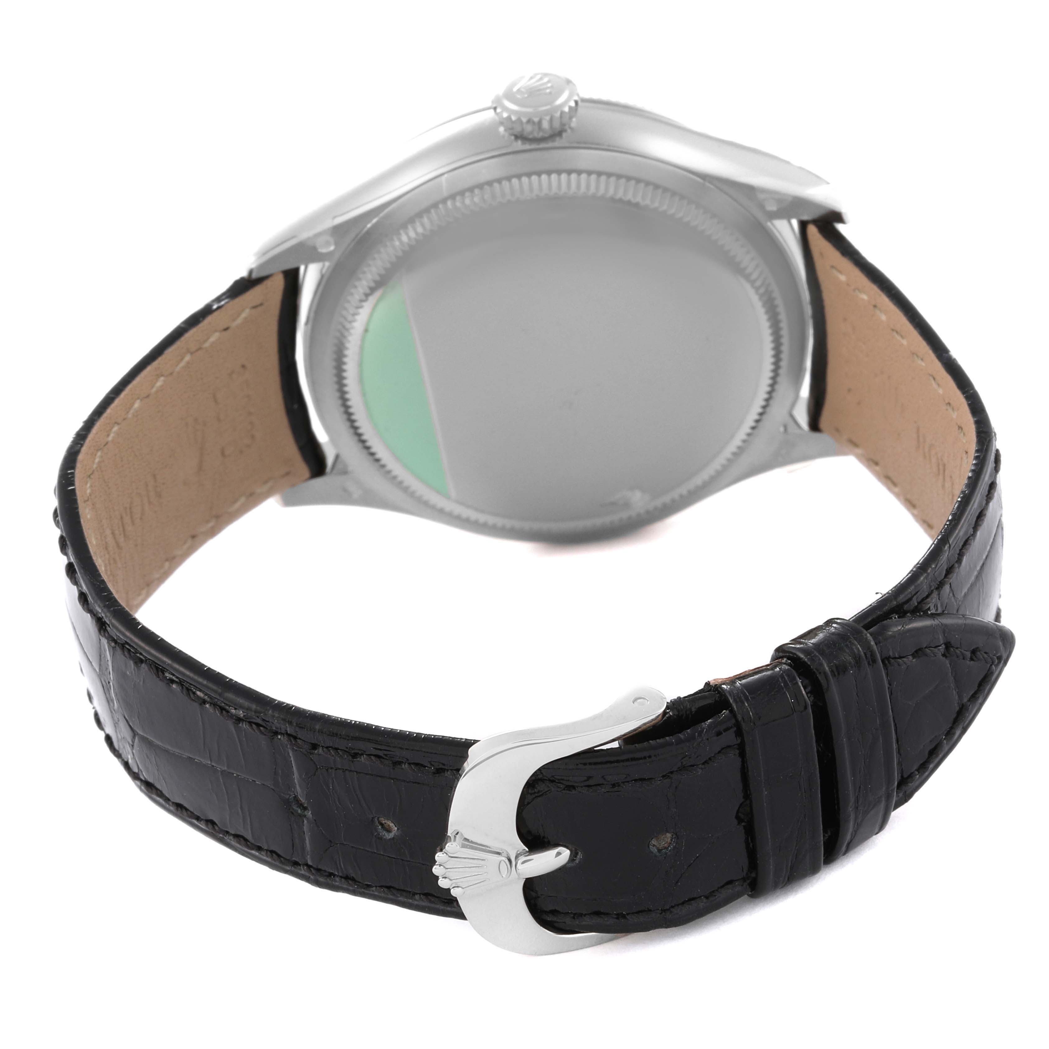 The image shows the back view of a Rolex Cellini 50509 Men's White Gold White Dial 50509 Men's White Gold White Dial watch highlighting the case back, crown, and leather strap with buckle.