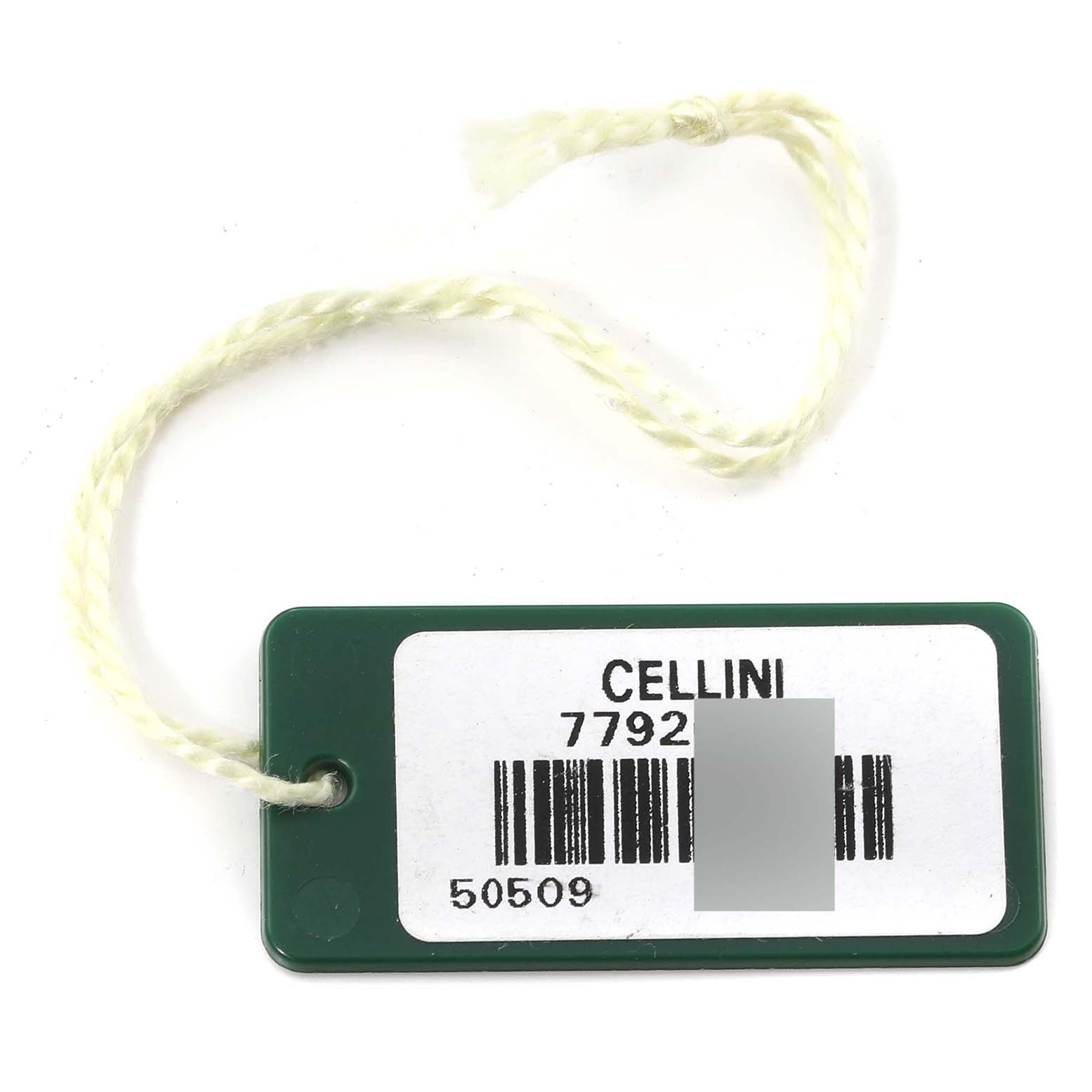 This image shows a green and white tag with a barcode for the Rolex Cellini 50509 Men's White Gold White Dial 50509 Men's White Gold White Dial model 7792.