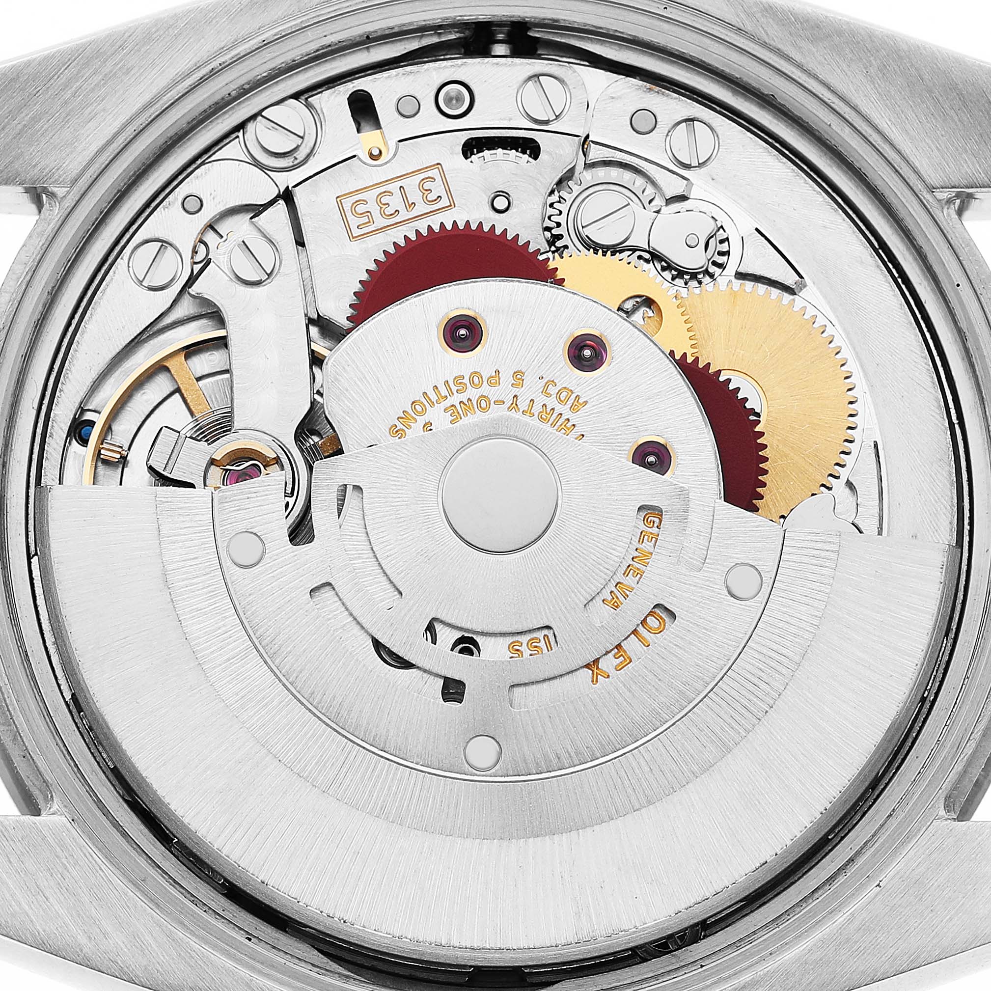 The image shows the movement from the back of a Rolex Date 115234 Men's Stainless Steel Blue Dial watch, highlighting gears and mechanical components.