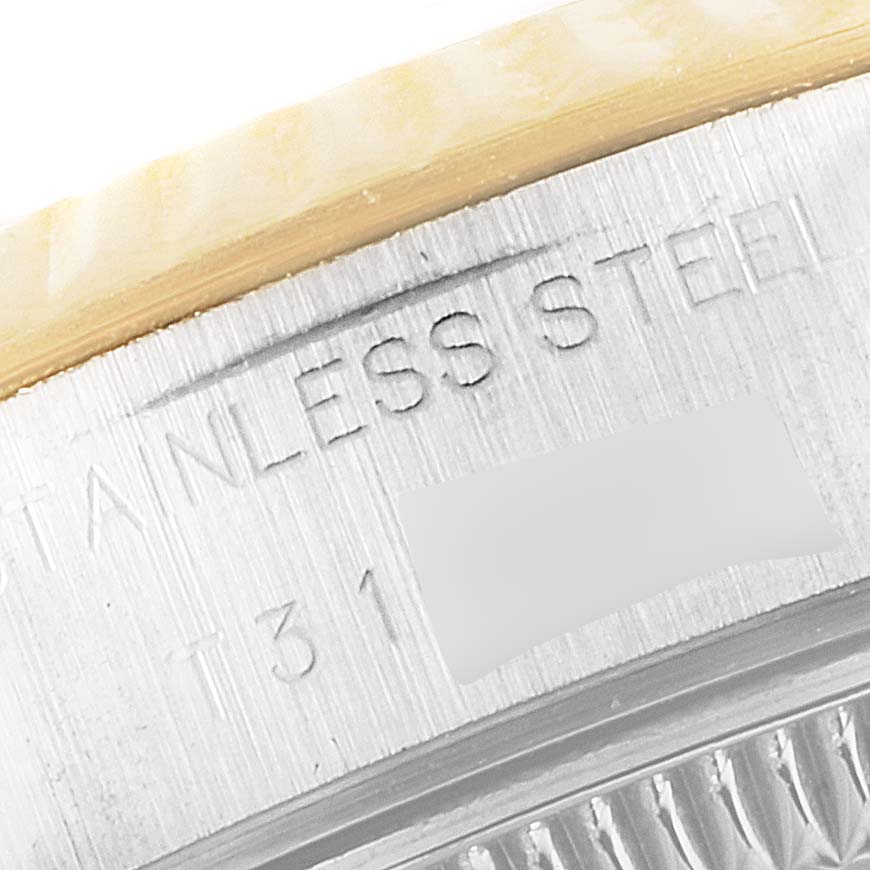 This image shows a close-up of the case side of a Rolex Datejust 69173 Women
s Steel and Gold (two tone) Champagne Dial 69173 Women
s Steel and Gold (two tone) Champagne Dial watch, highlighting the stainless steel lettering.