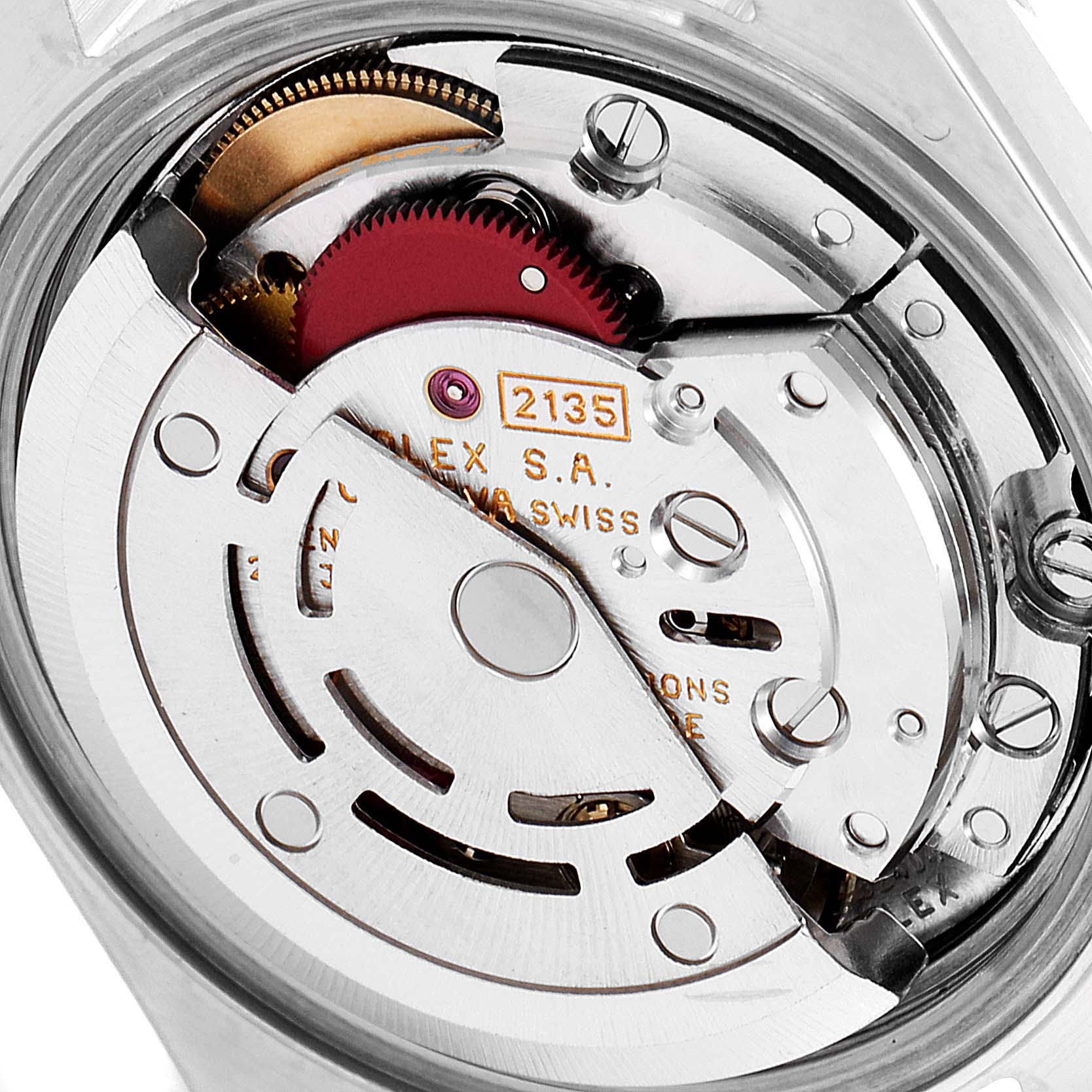 This image shows close-up of the movement mechanism inside a Rolex Datejust 69173 Women
s Steel and Gold (two tone) Champagne Dial 69173 Women
s Steel and Gold (two tone) Champagne Dial watch, highlighting gears and engraved text.